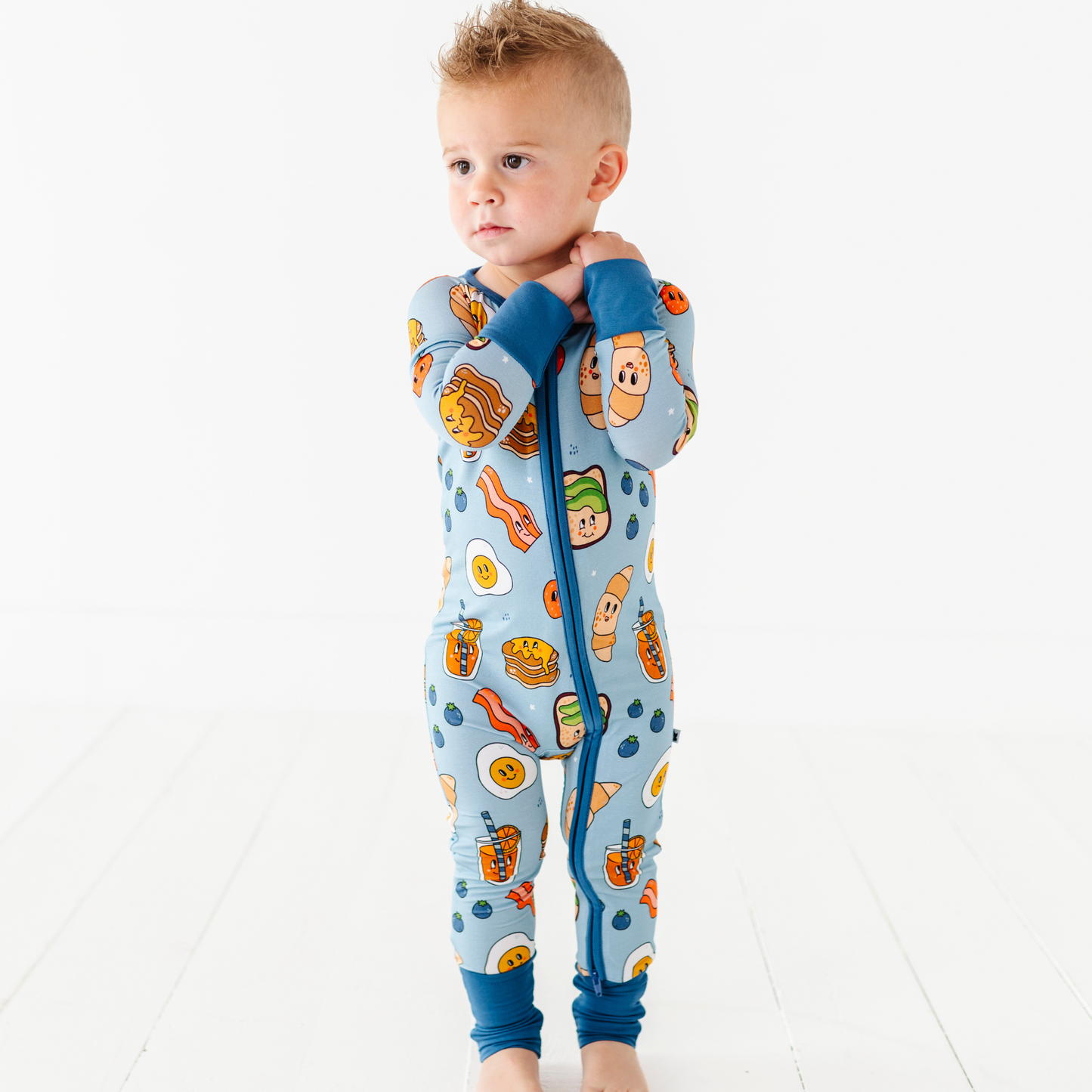 Baby in blue breakfast pajamas