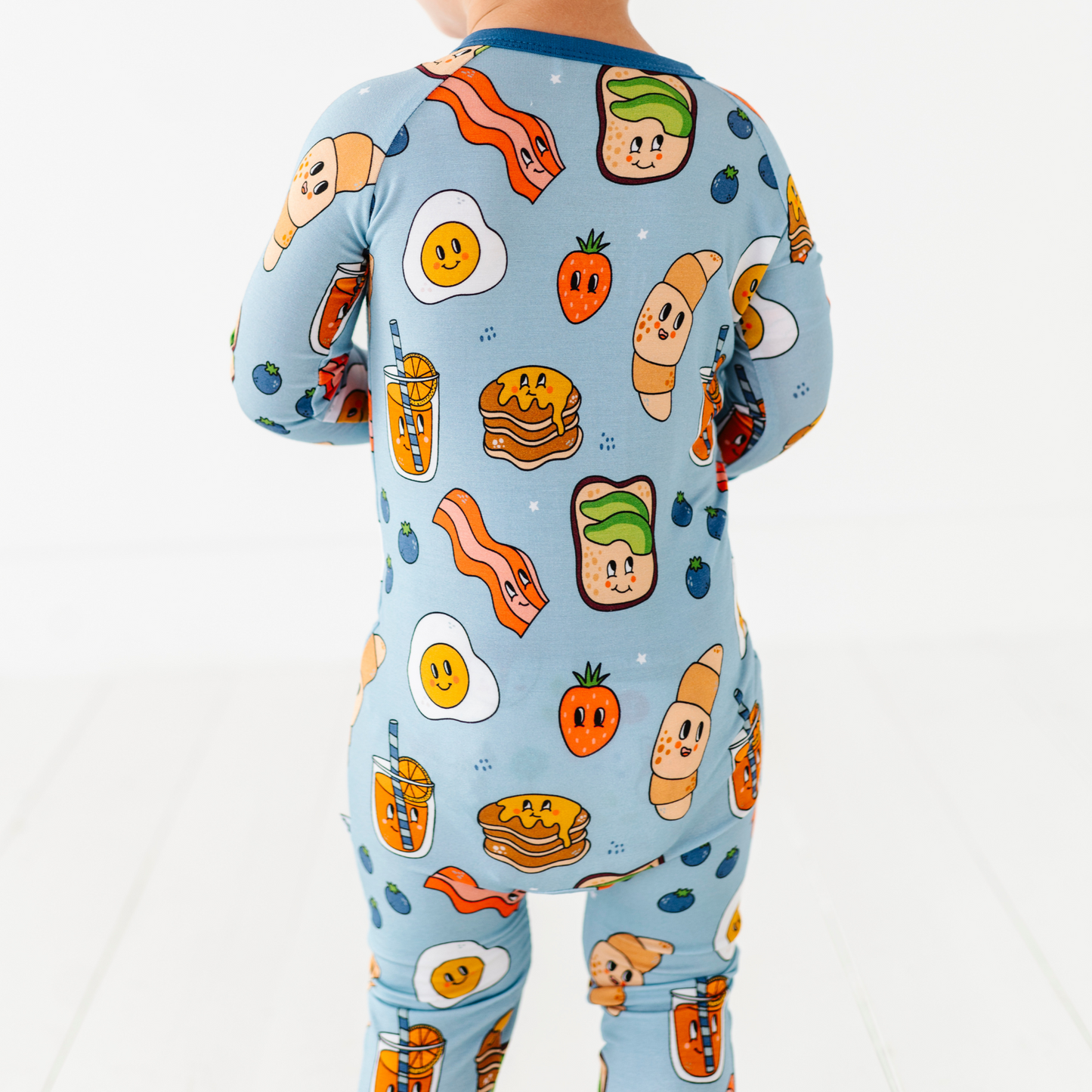 Baby in blue breakfast pajamas