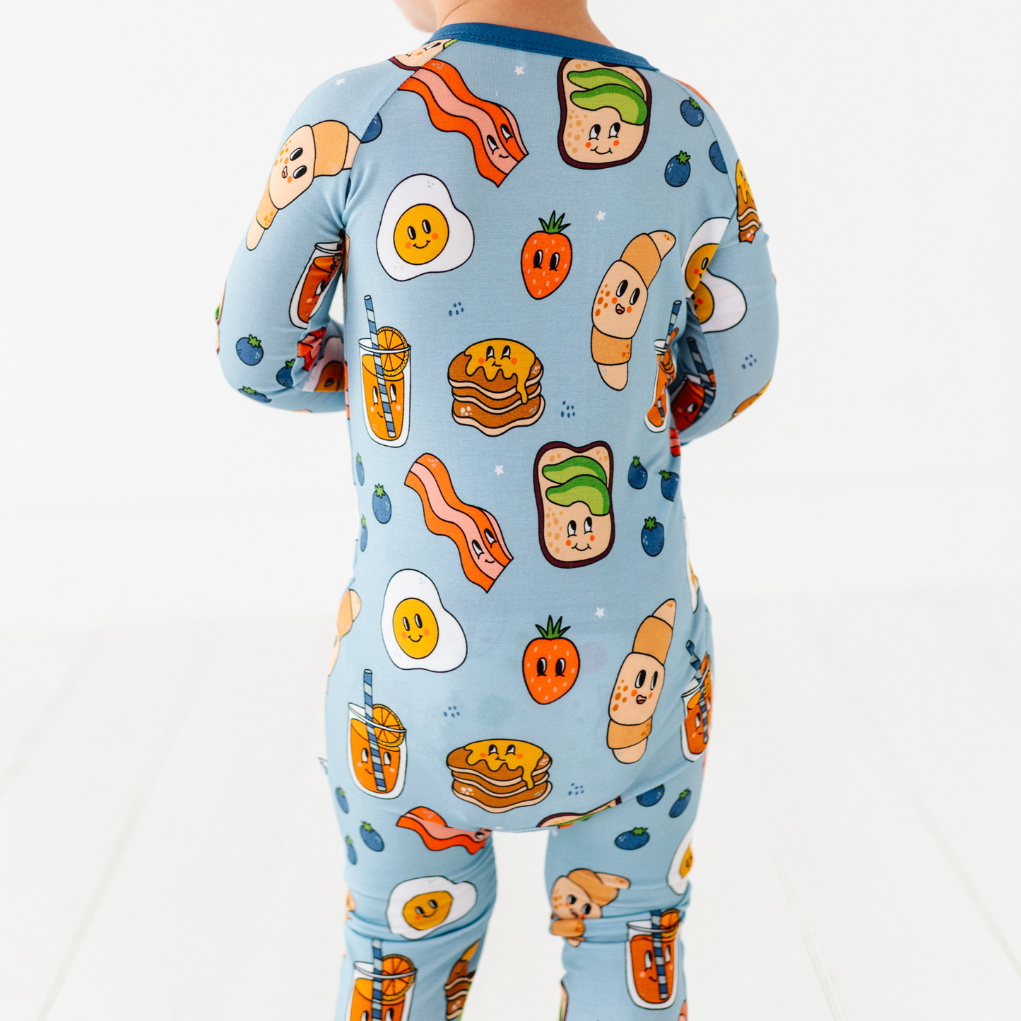 Baby in blue breakfast pajamas