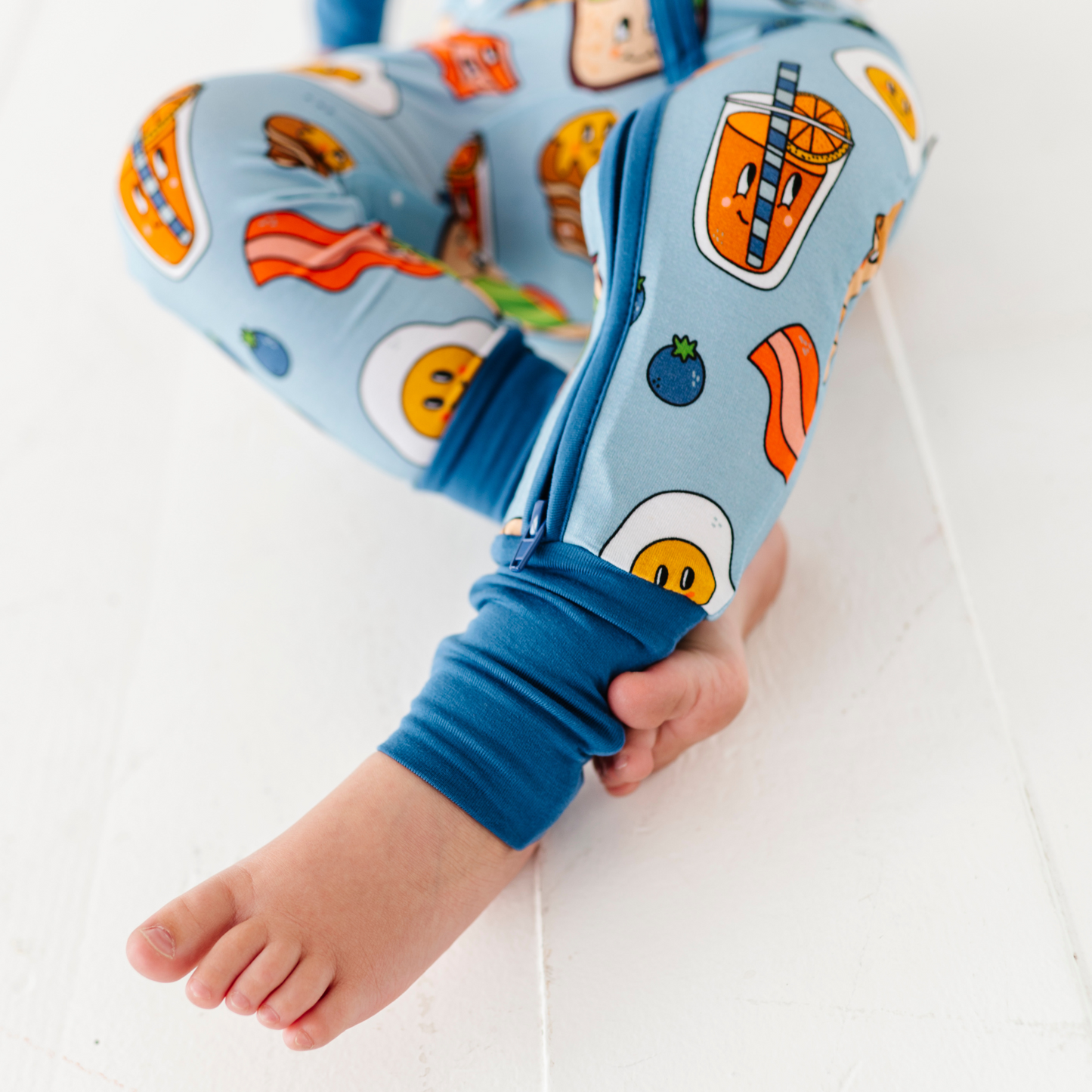 Baby in blue breakfast pajamas