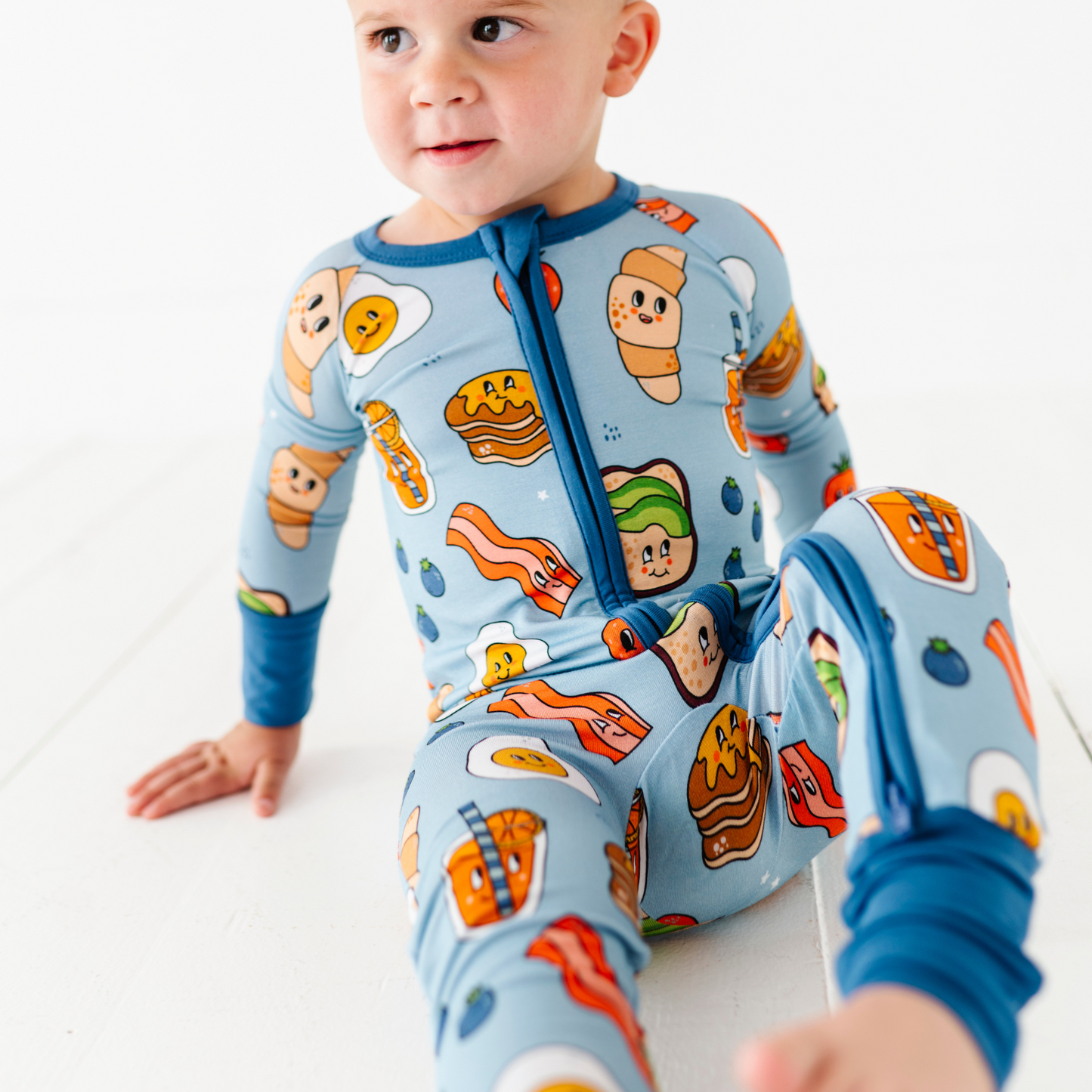 Baby in blue breakfast pajamas