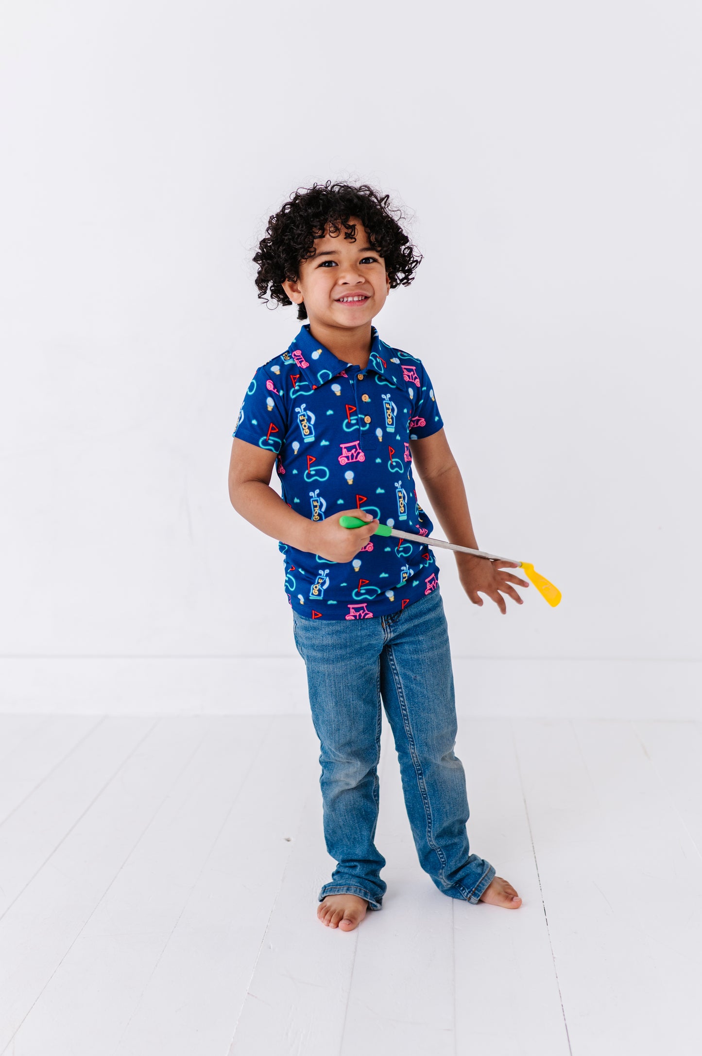 Boy Sporting Neon Golf Polo By Kiki and Lulu
