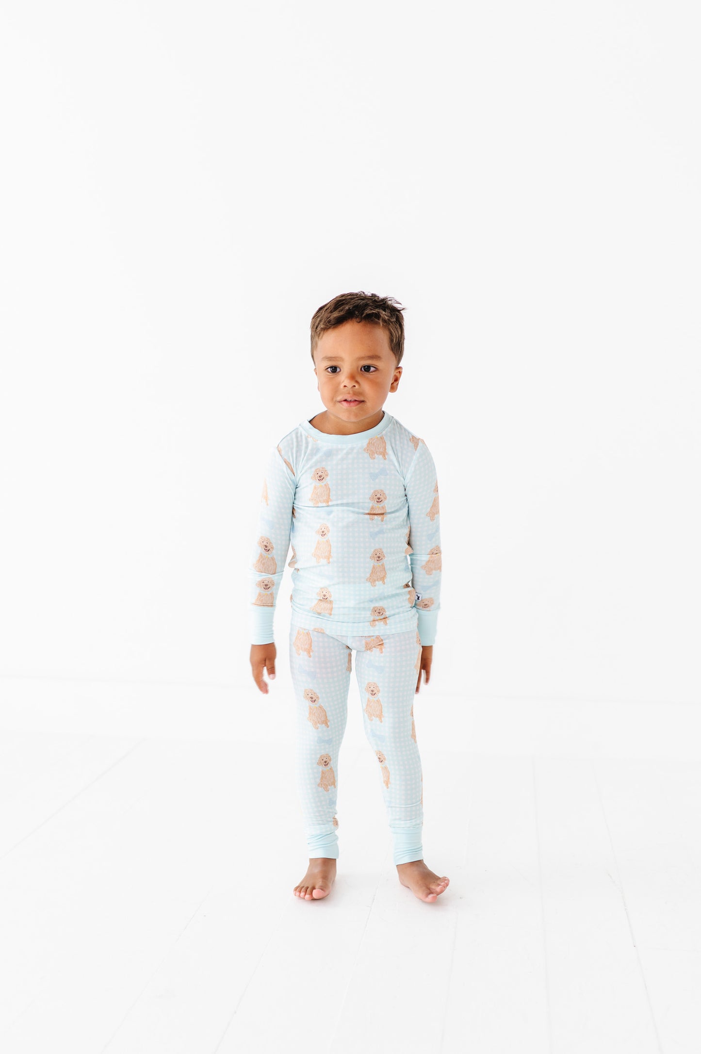 Boy In Goldendoodle Pajamas