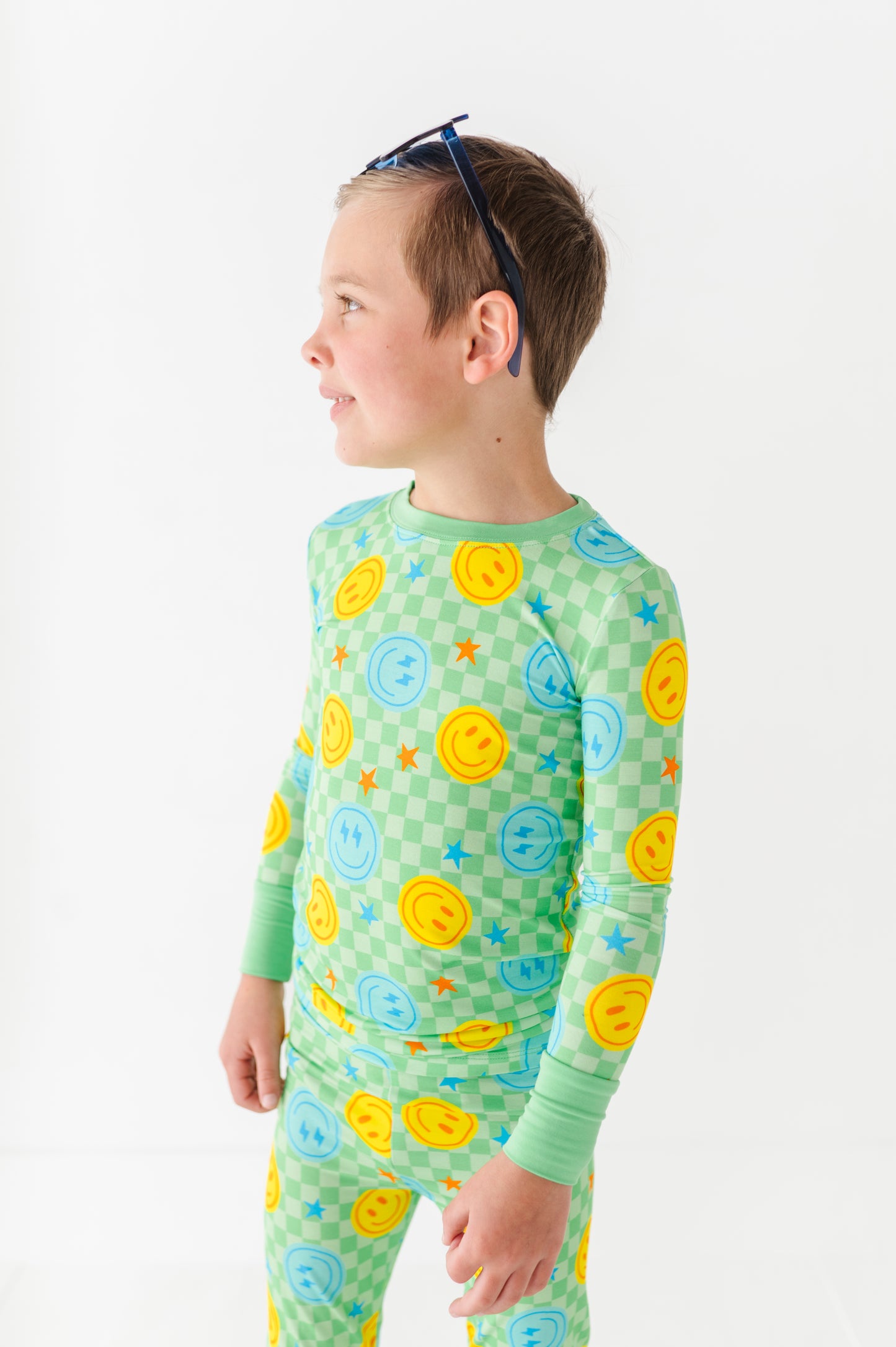 Boy wearing smiley pajamas