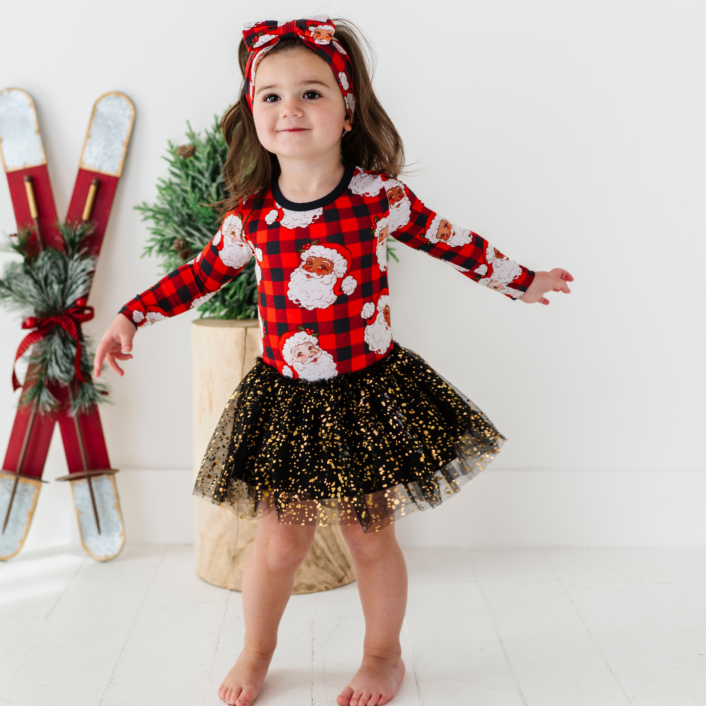 Girl in Christmas dress with tulle by Kiki and Lulu