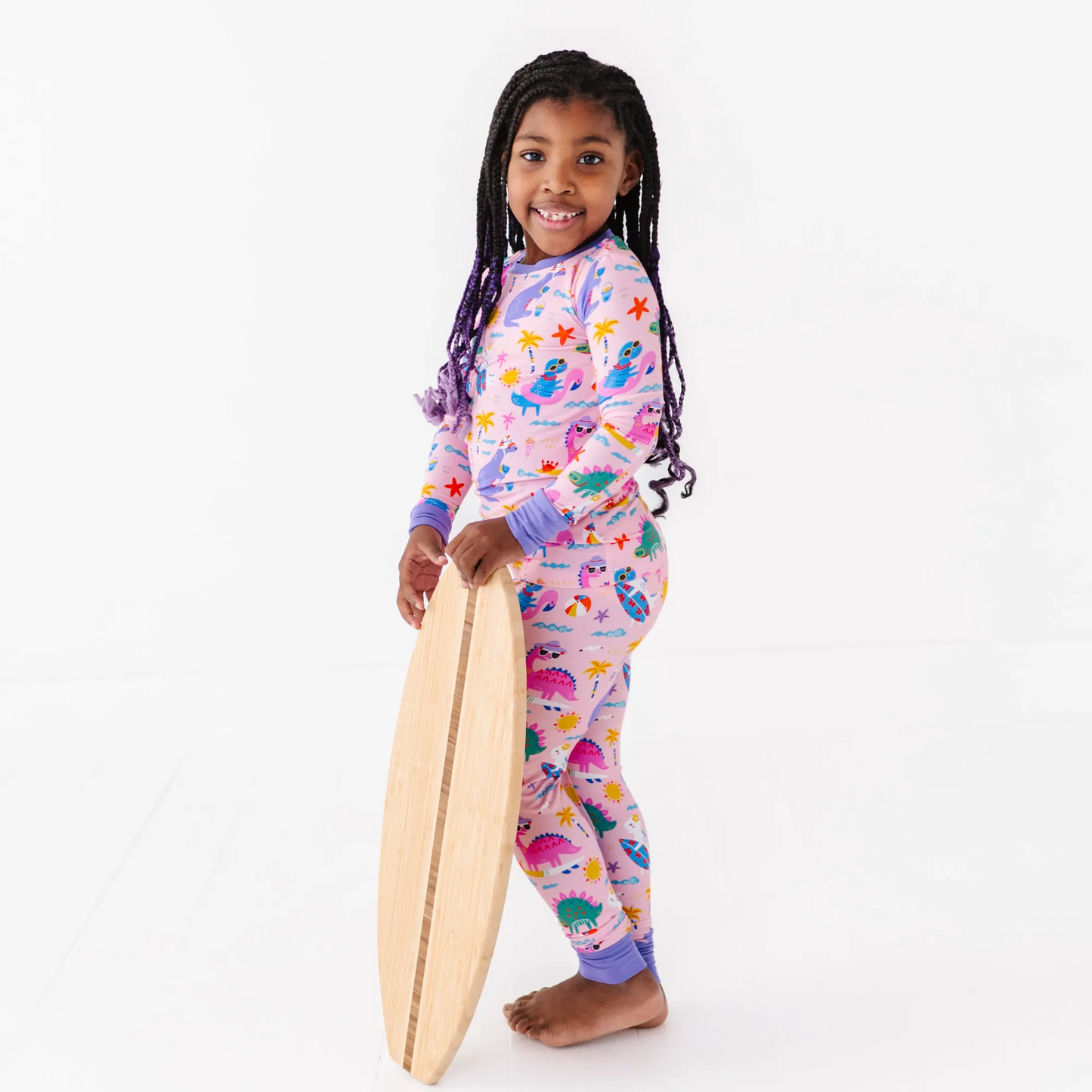 Pink dinosaur pajamas by Kiki and Lulu