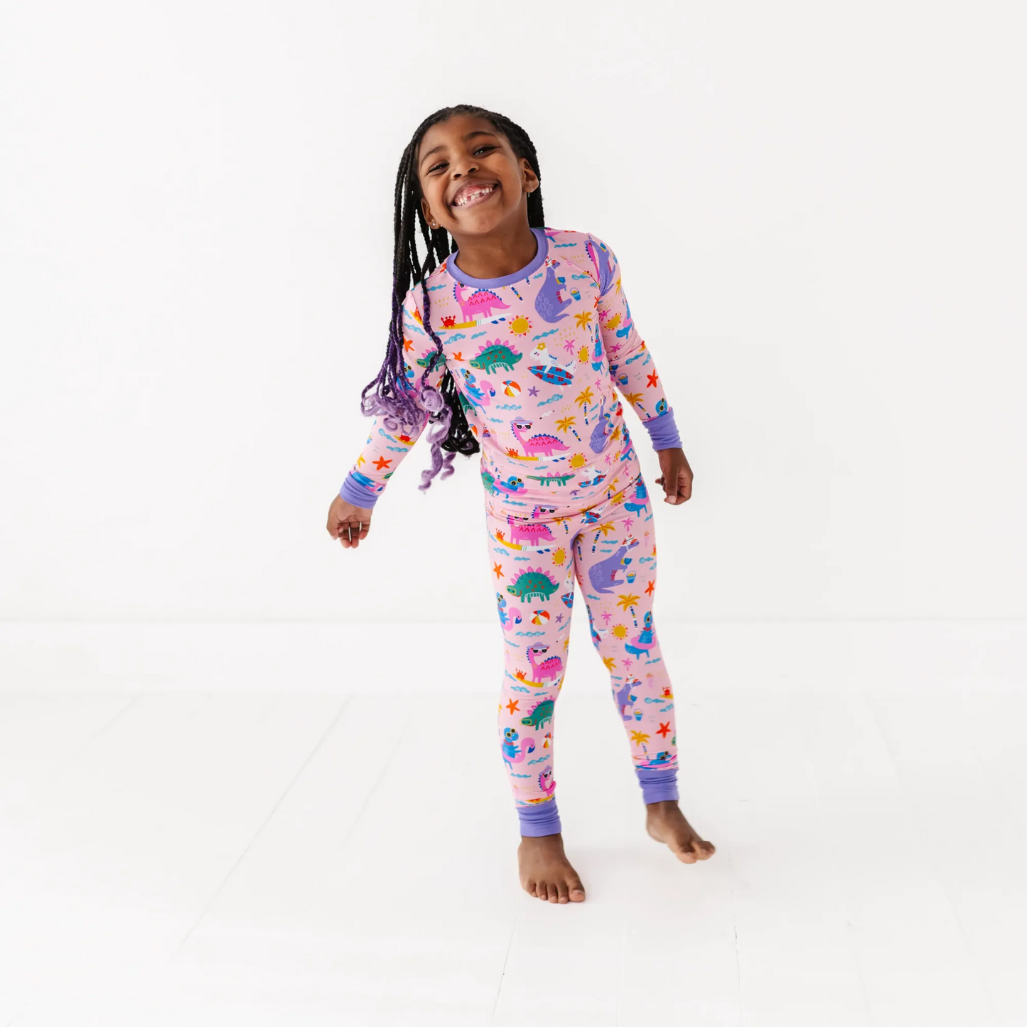 Pink dinosaur pajamas by Kiki and Lulu