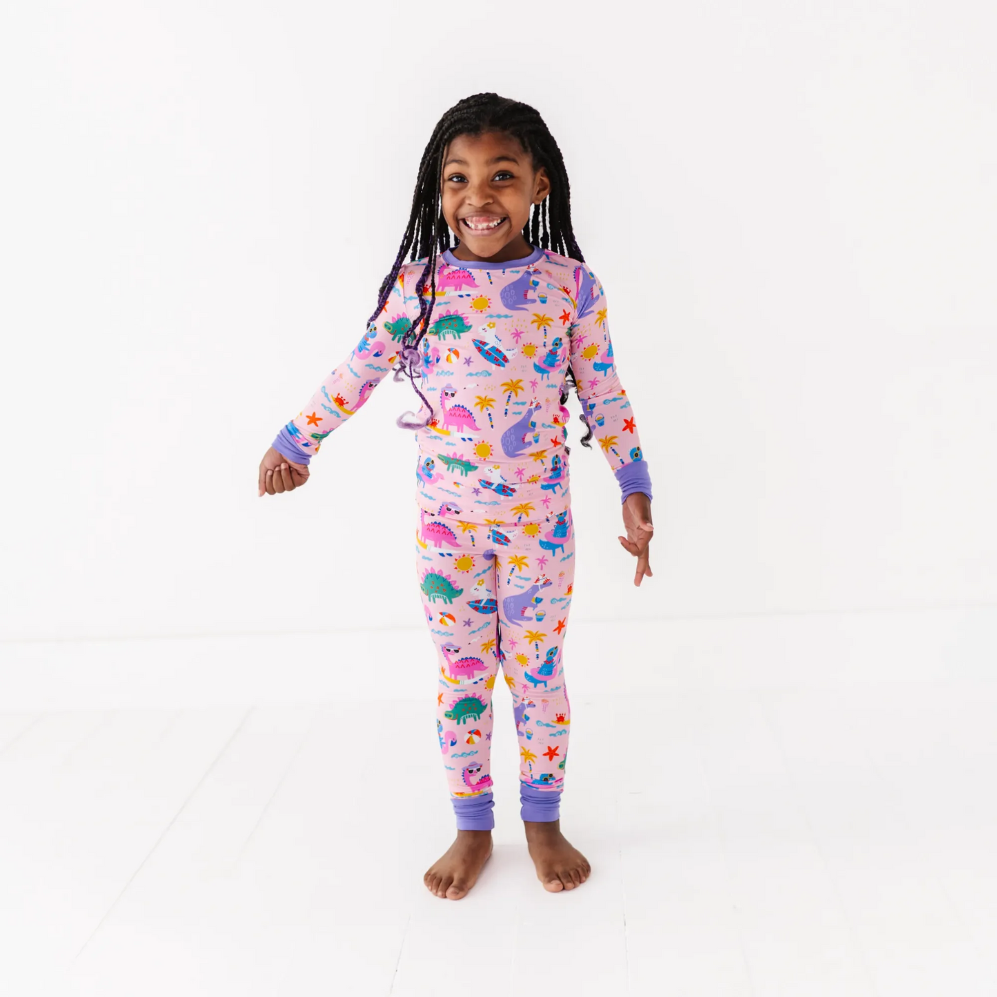 Pink dinosaur pajamas by Kiki and Lulu