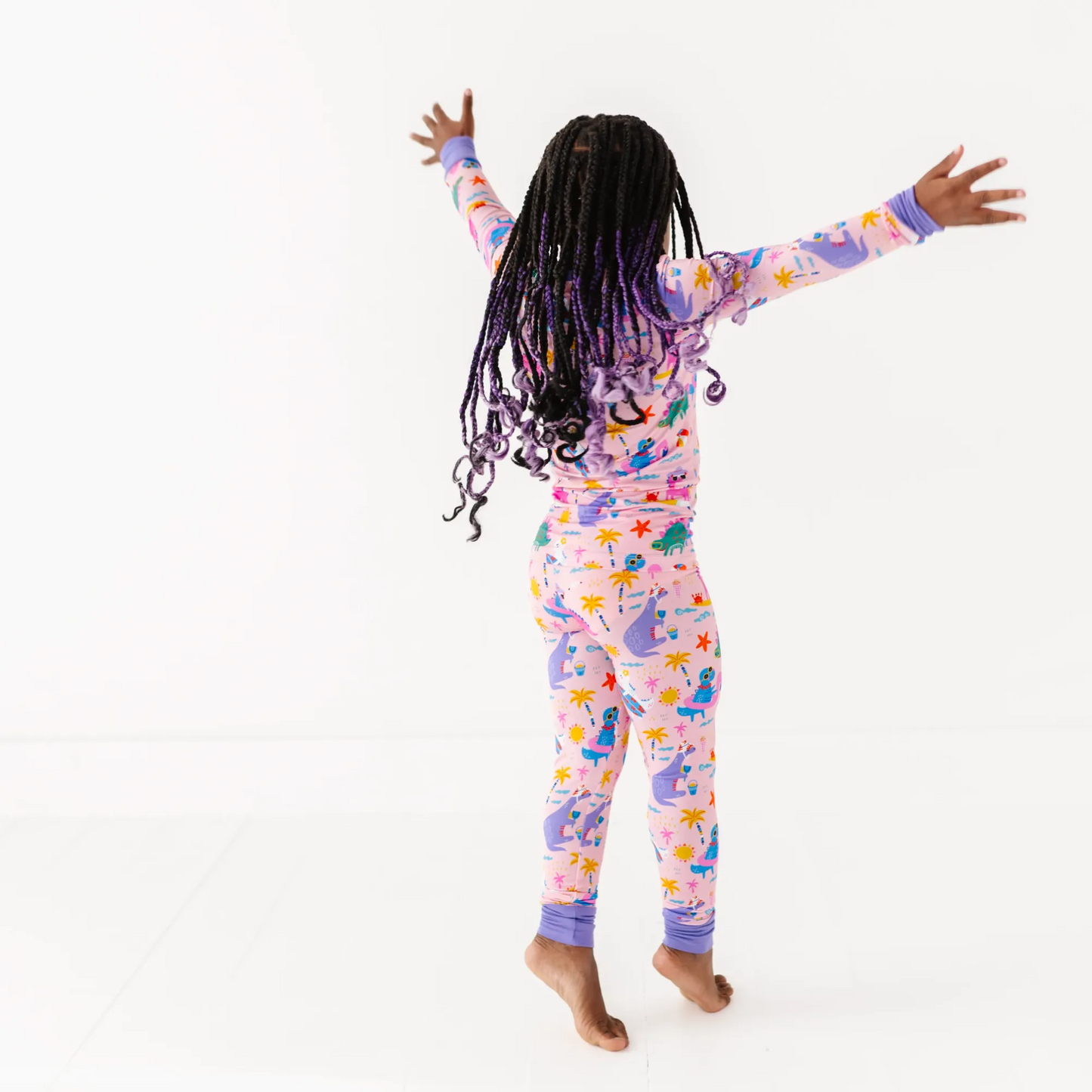 Pink dinosaur pajamas by Kiki and Lulu