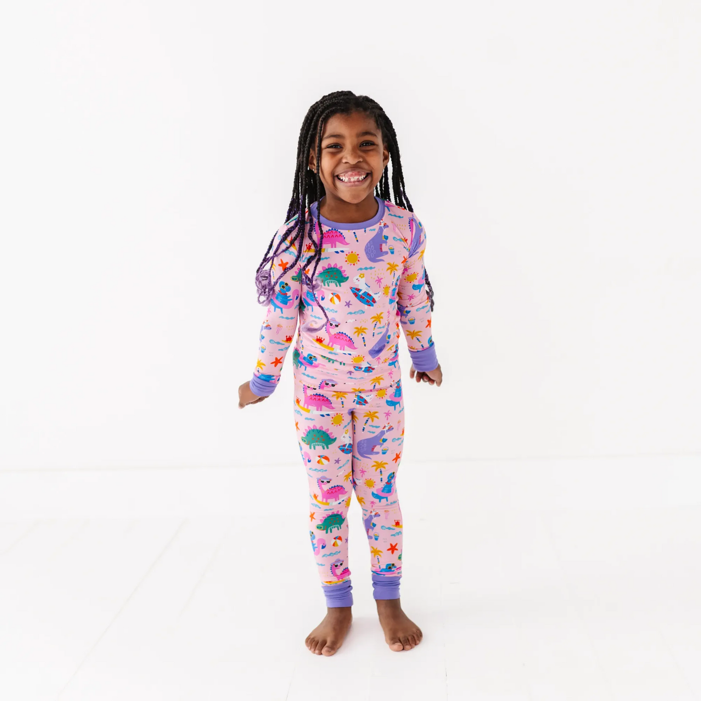 Pink dinosaur pajamas by Kiki and Lulu
