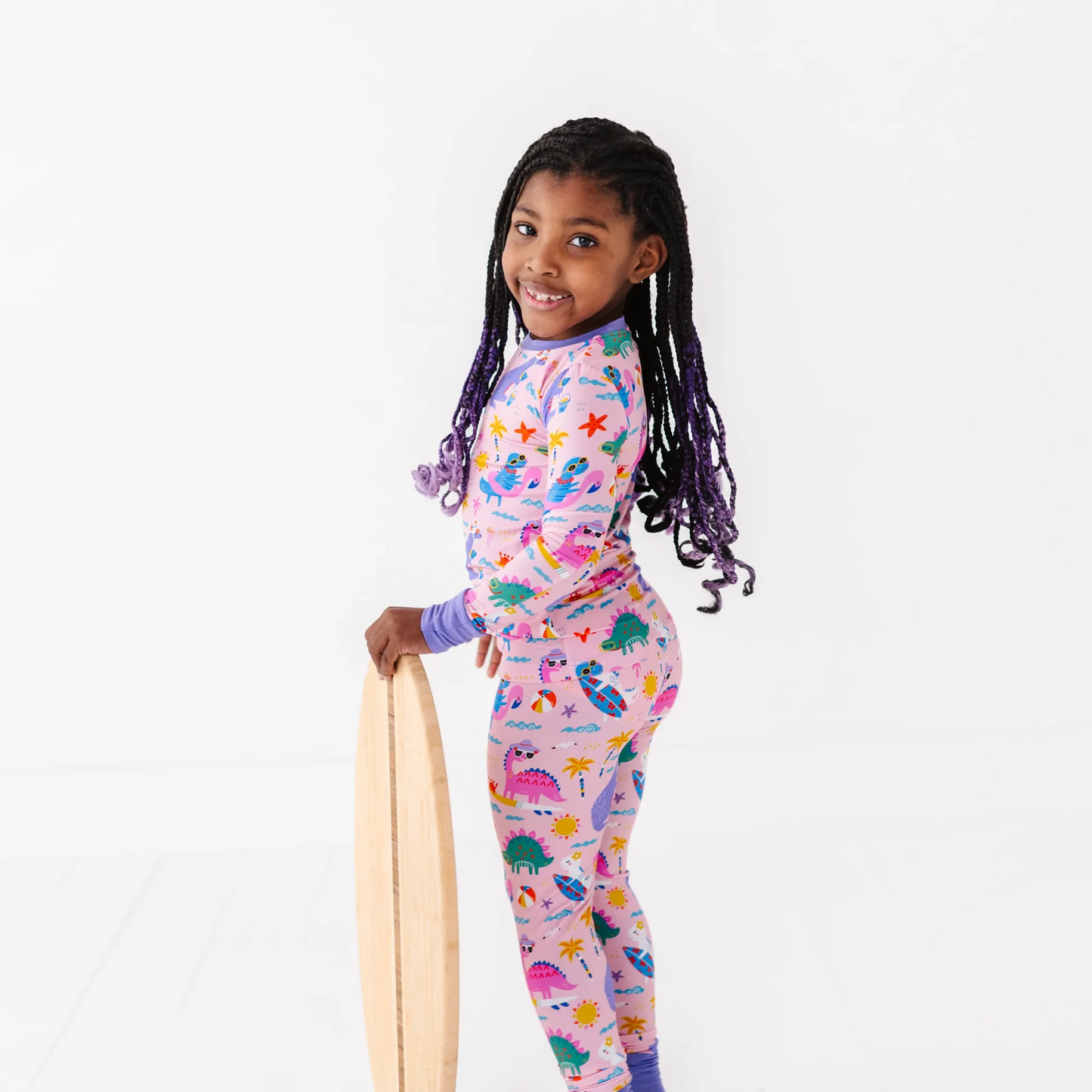 Pink dinosaur pajamas by Kiki and Lulu