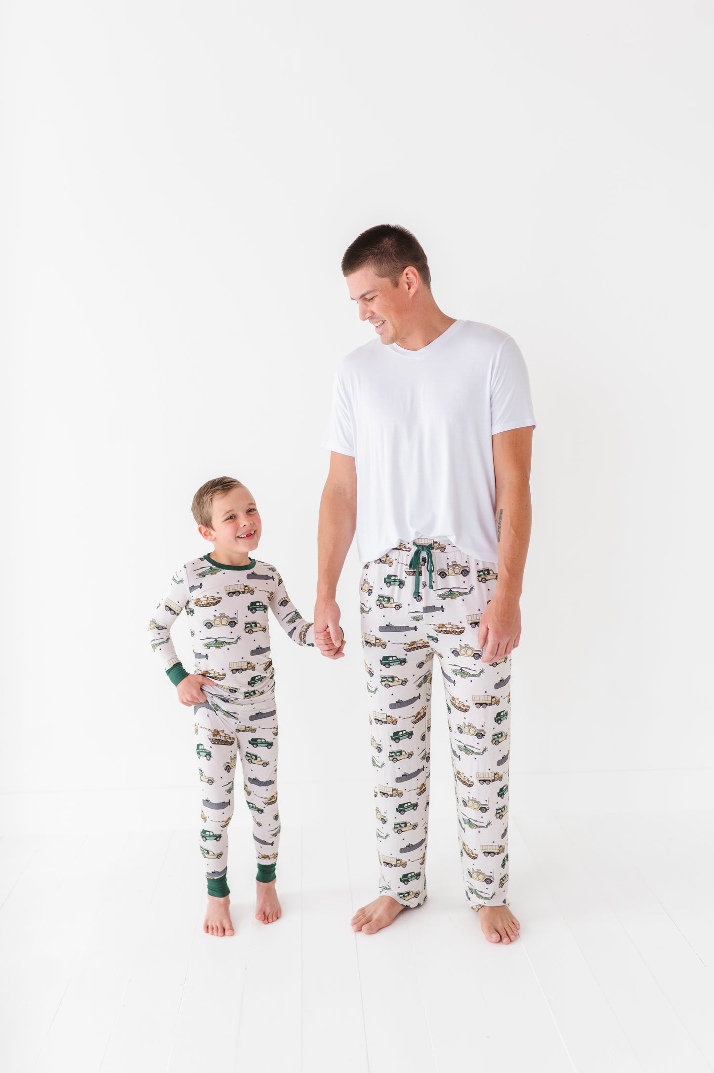 Father and son in matching military pajamas