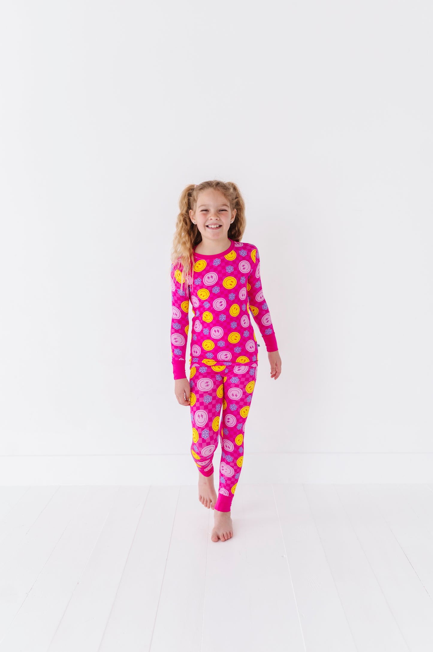 Girl wearing smiley pajamas