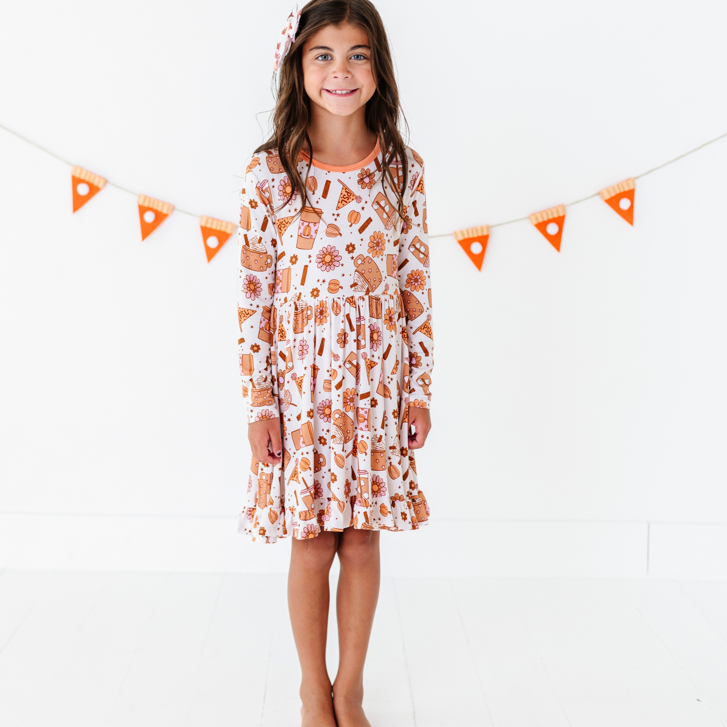 Girl in Pumpkin Spice Latte Dress by Kiki and Lulu