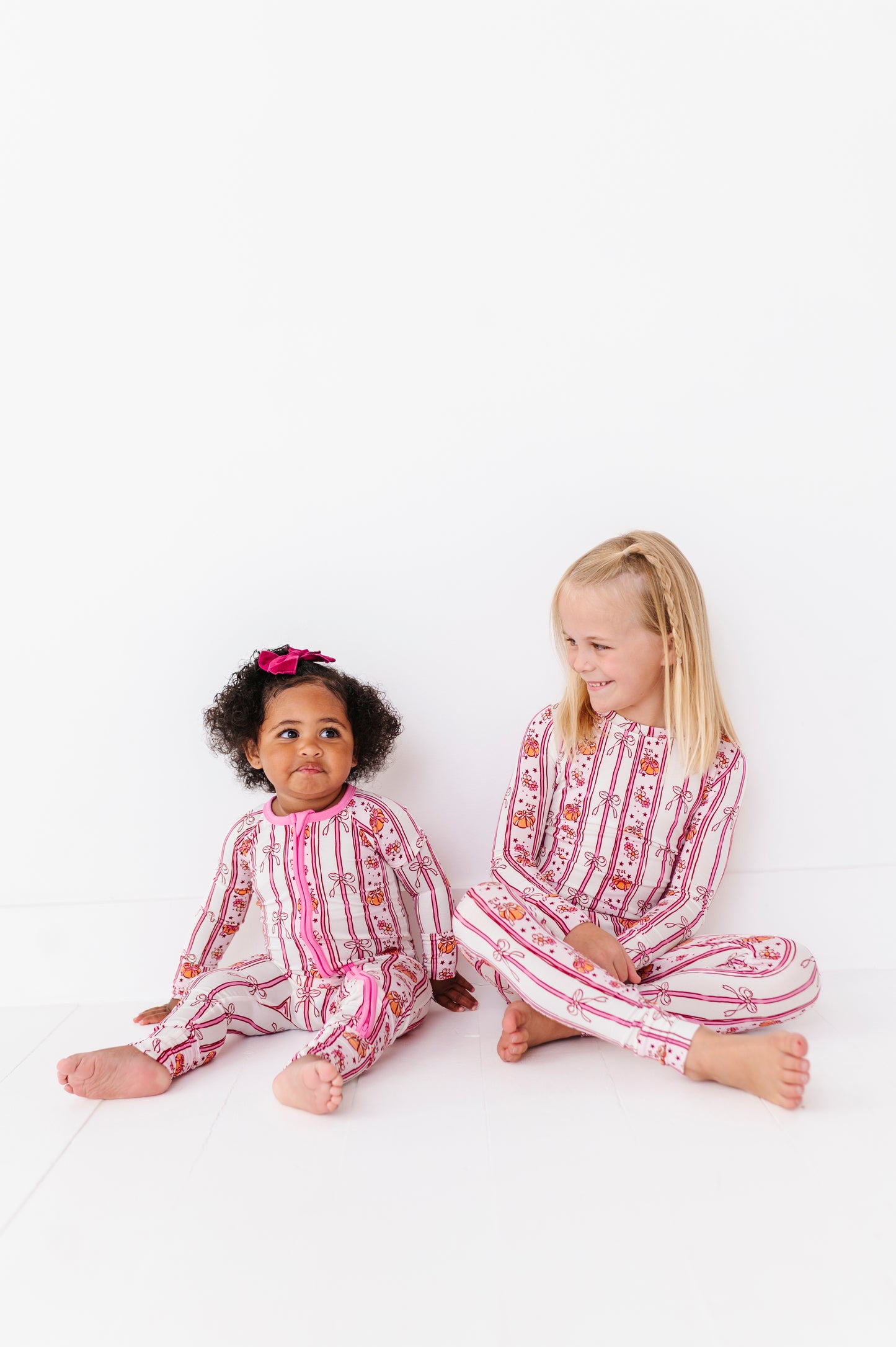 Girls in Matching Pumpkin Pajamas