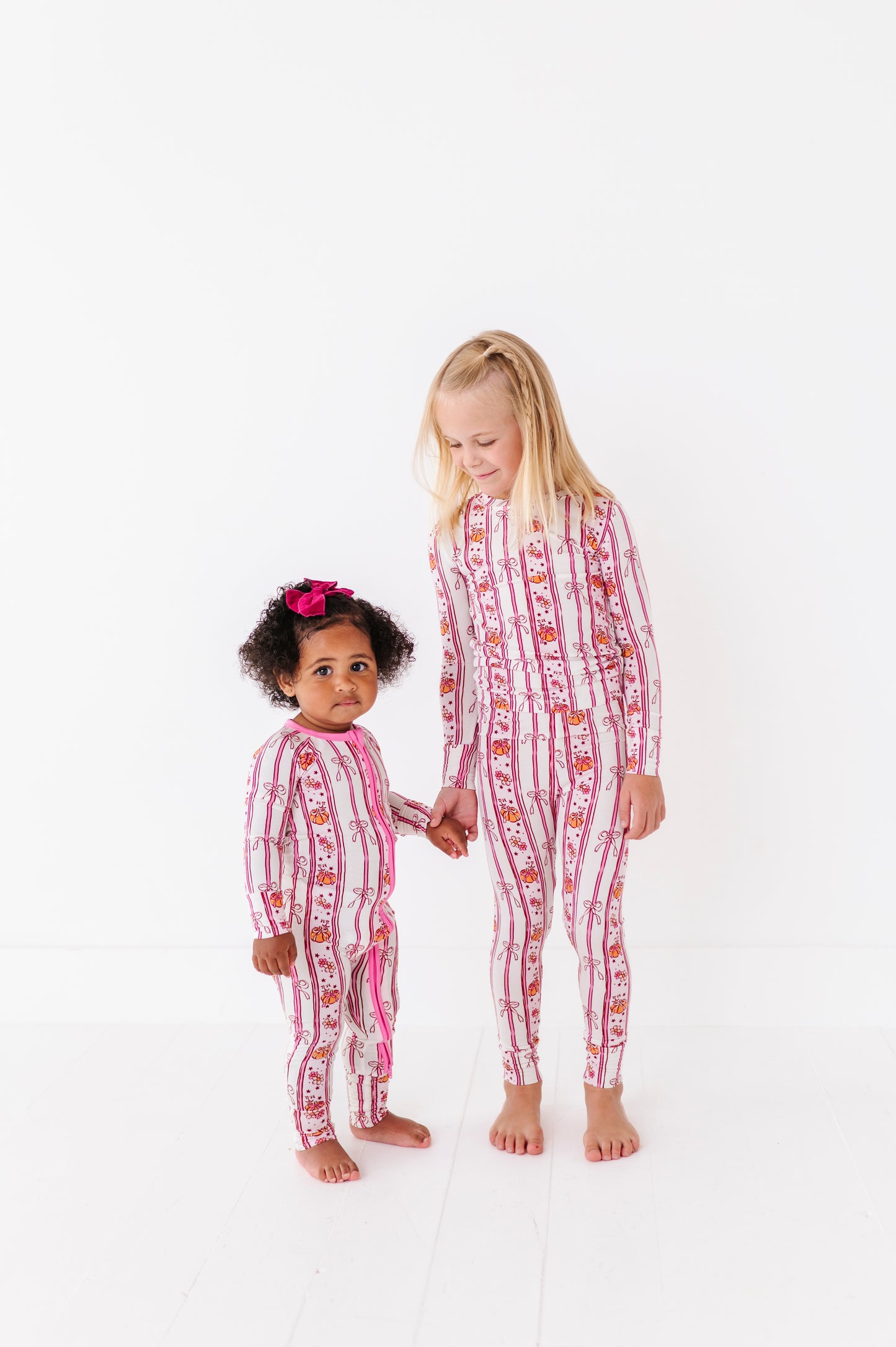 Girls in Matching Pumpkin Pajamas