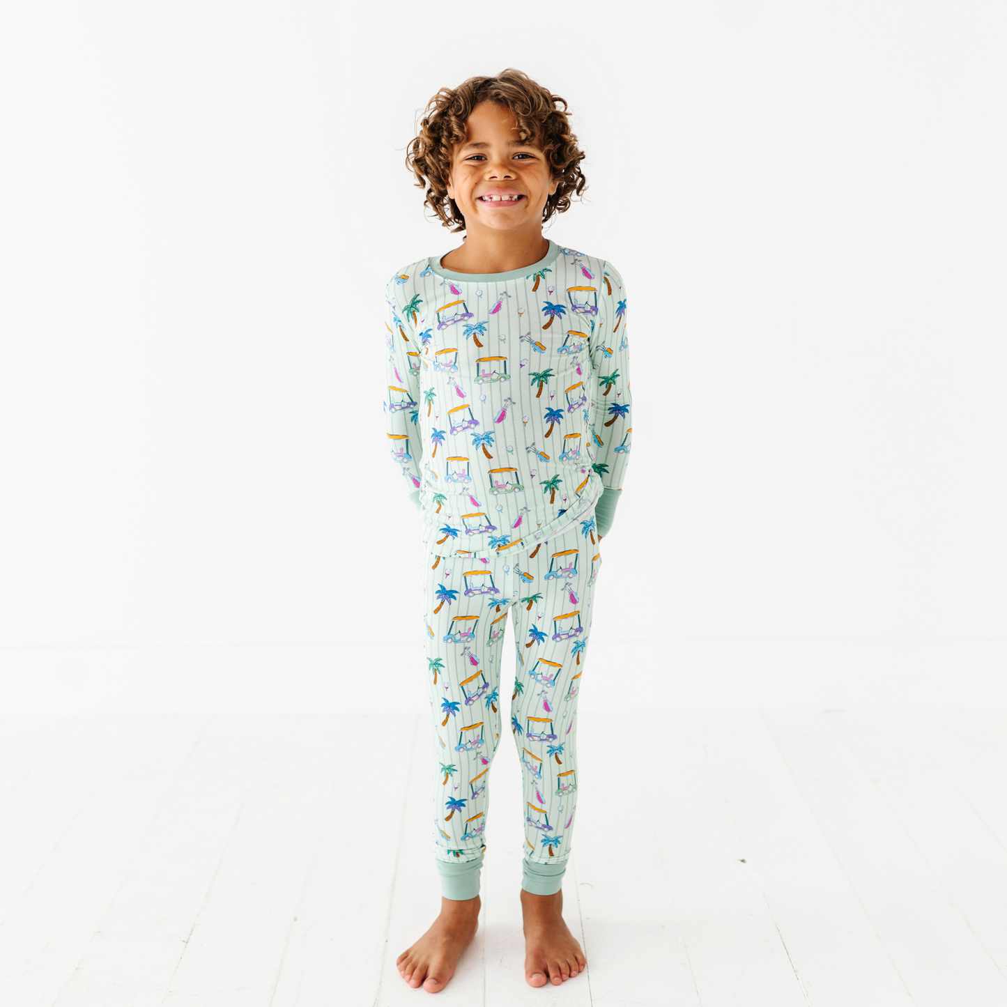 Kid in Golf Pajamas By Kiki and Lulu