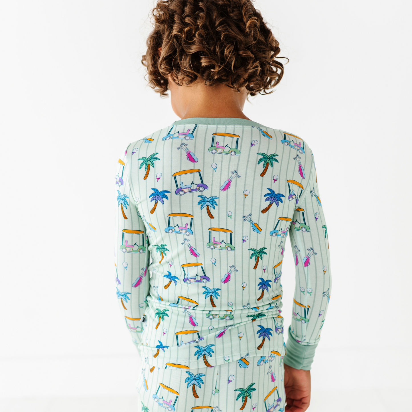 Kid in Golf Pajamas By Kiki and Lulu