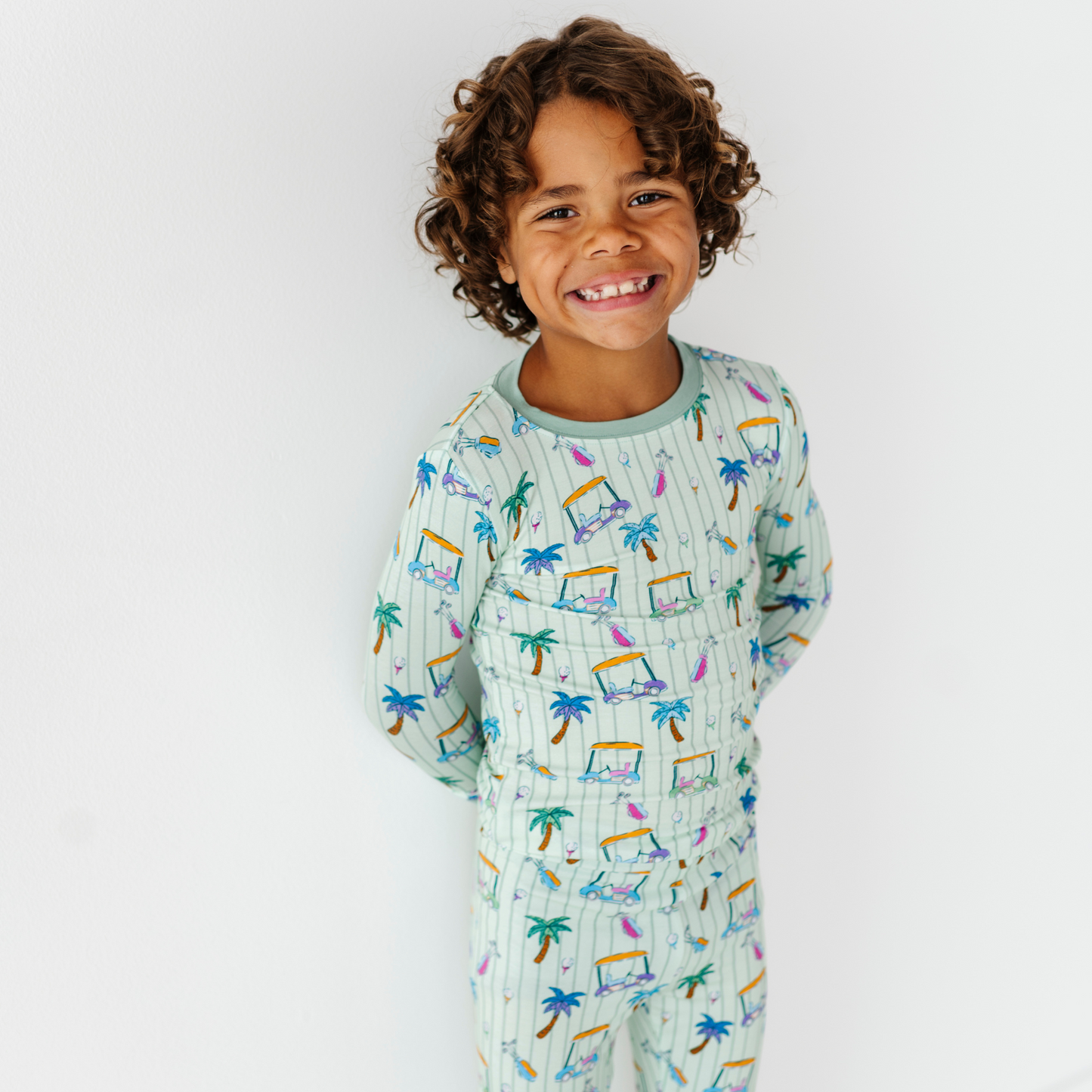 Kid in Golf Pajamas By Kiki and Lulu
