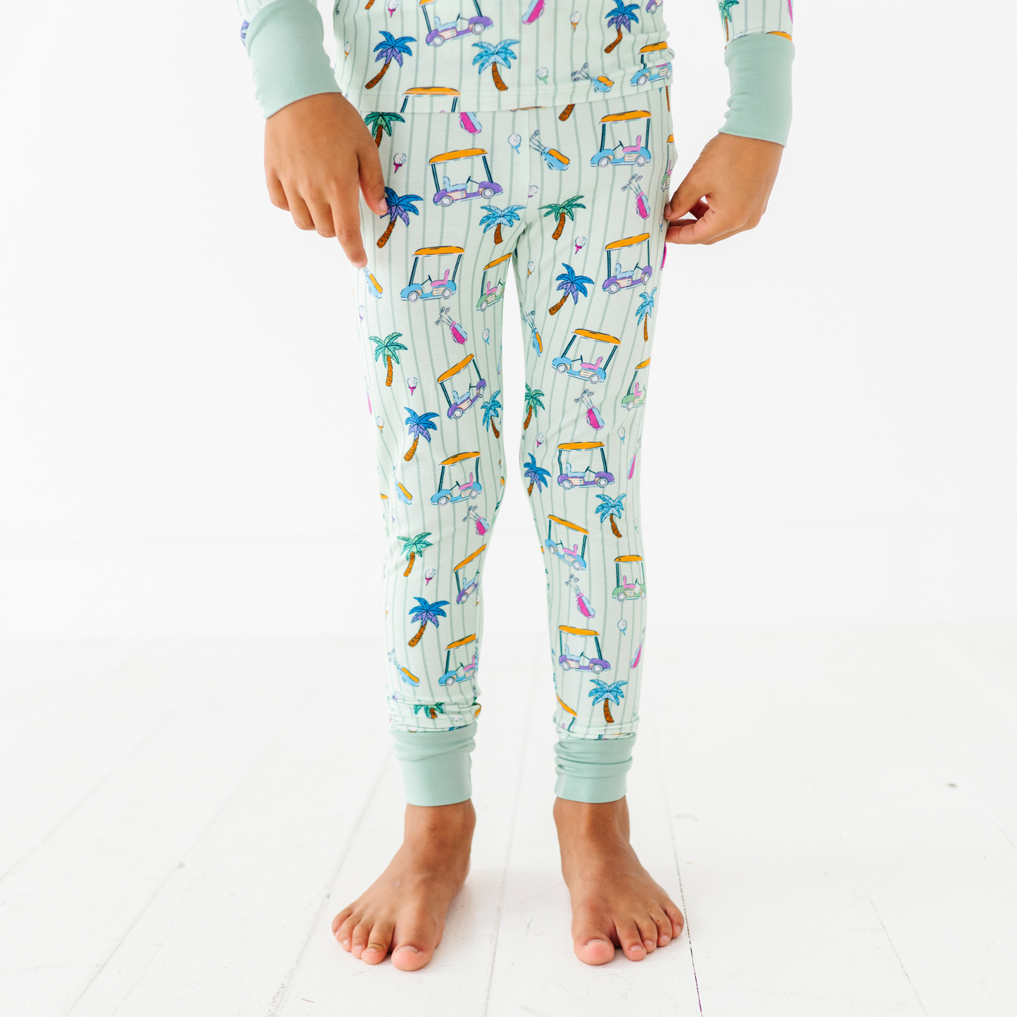 Kid in Golf Pajamas By Kiki and Lulu