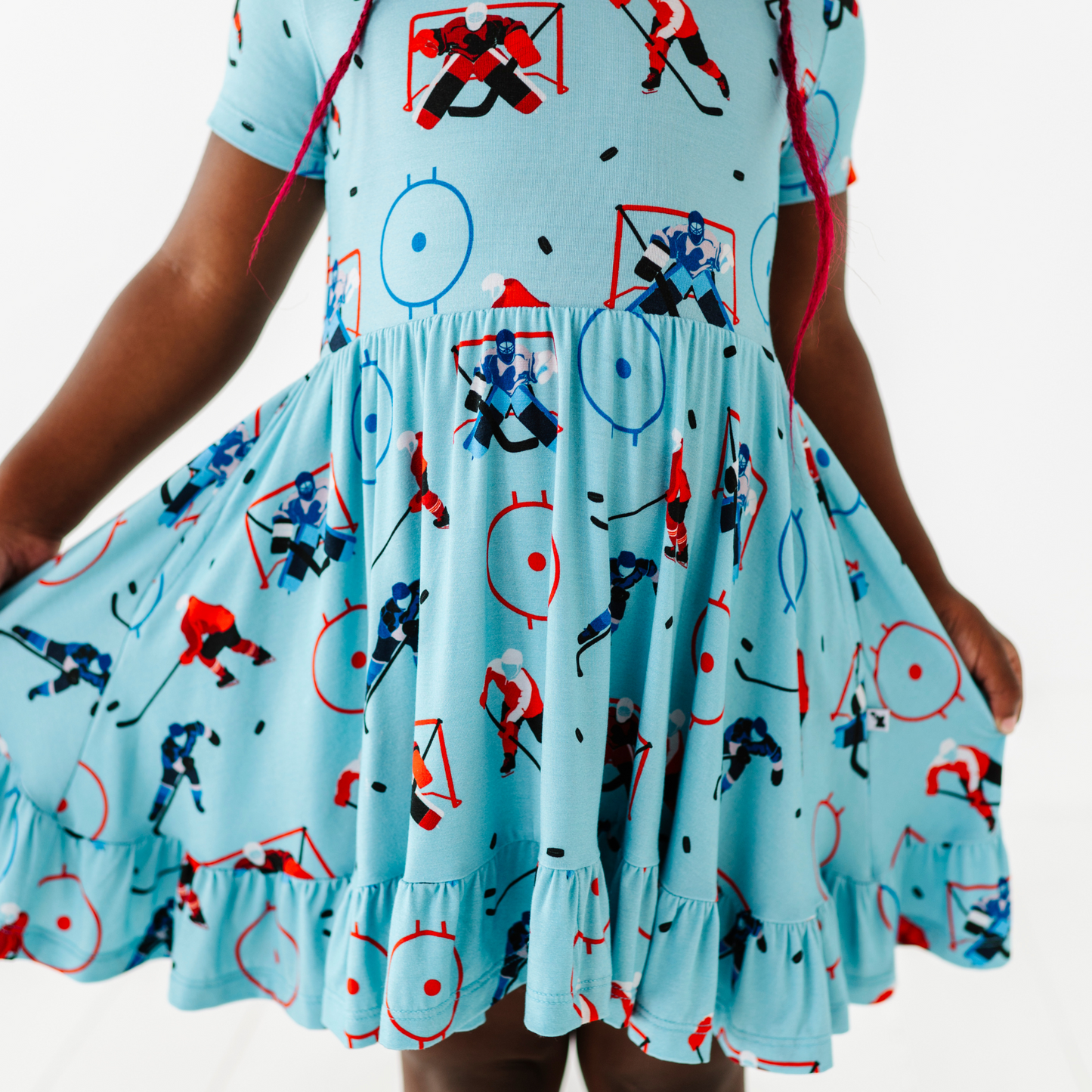 Girl wearing hockey dress by Kiki and Lulu