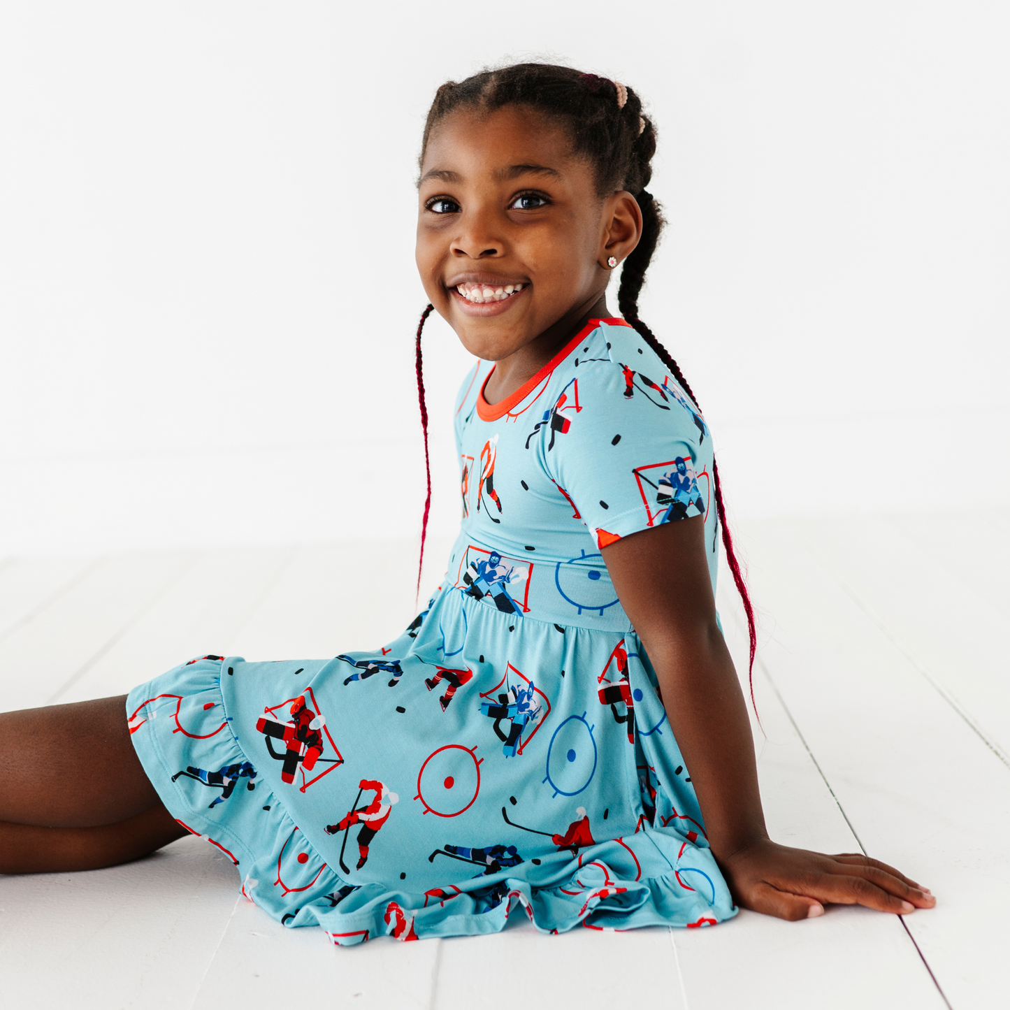 Girl wearing hockey dress by Kiki and Lulu