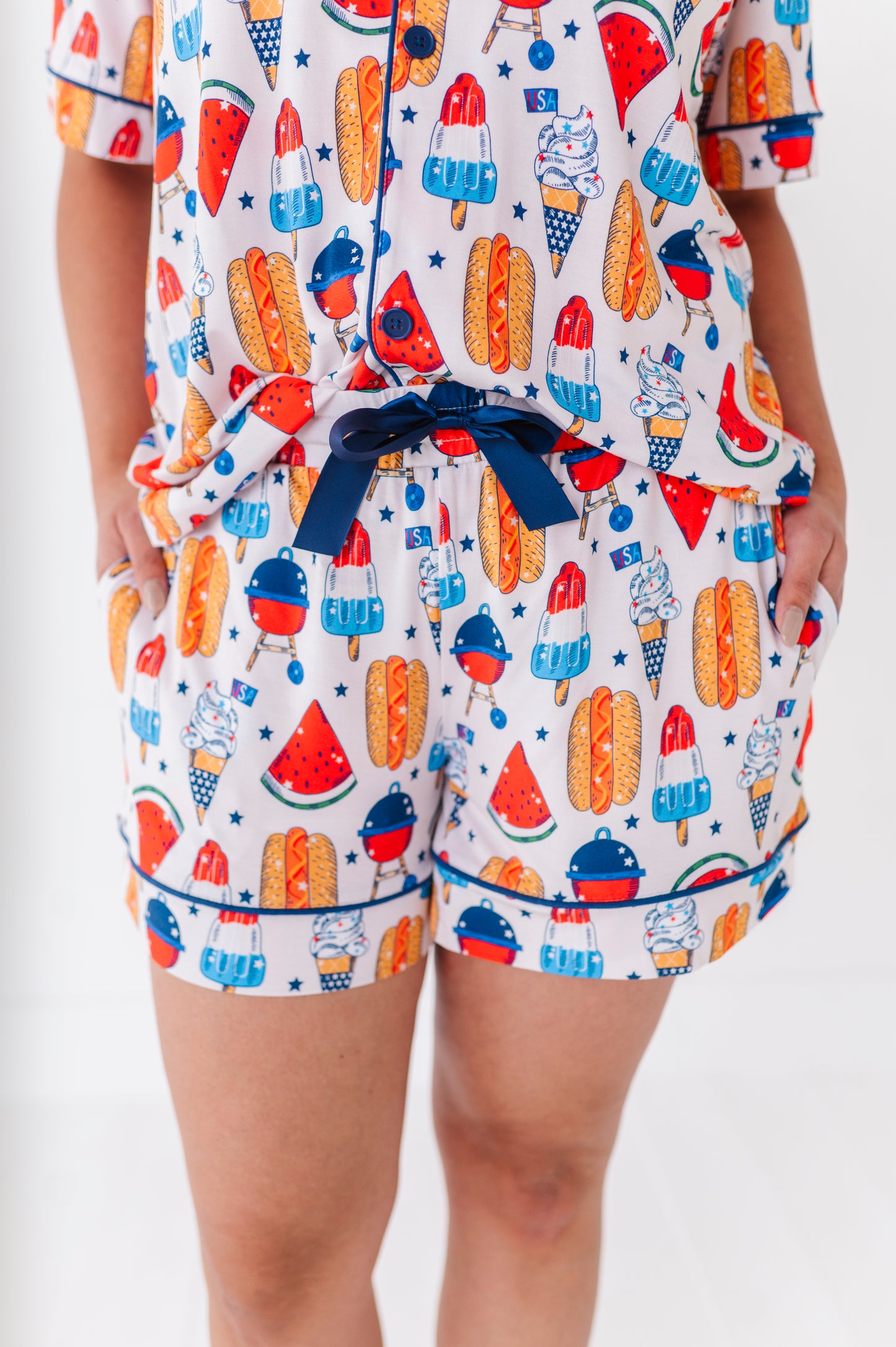 Mom wearing 4th of July hot dog pajamas made from soft bamboo fabric, perfect for matching family sets