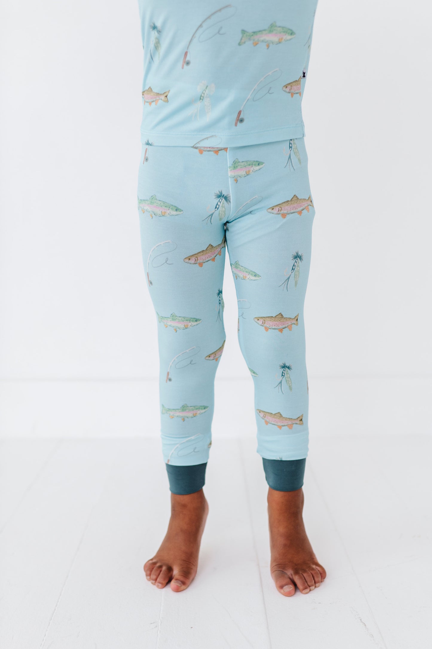 Light blue pajama set with fish pattern on a white background