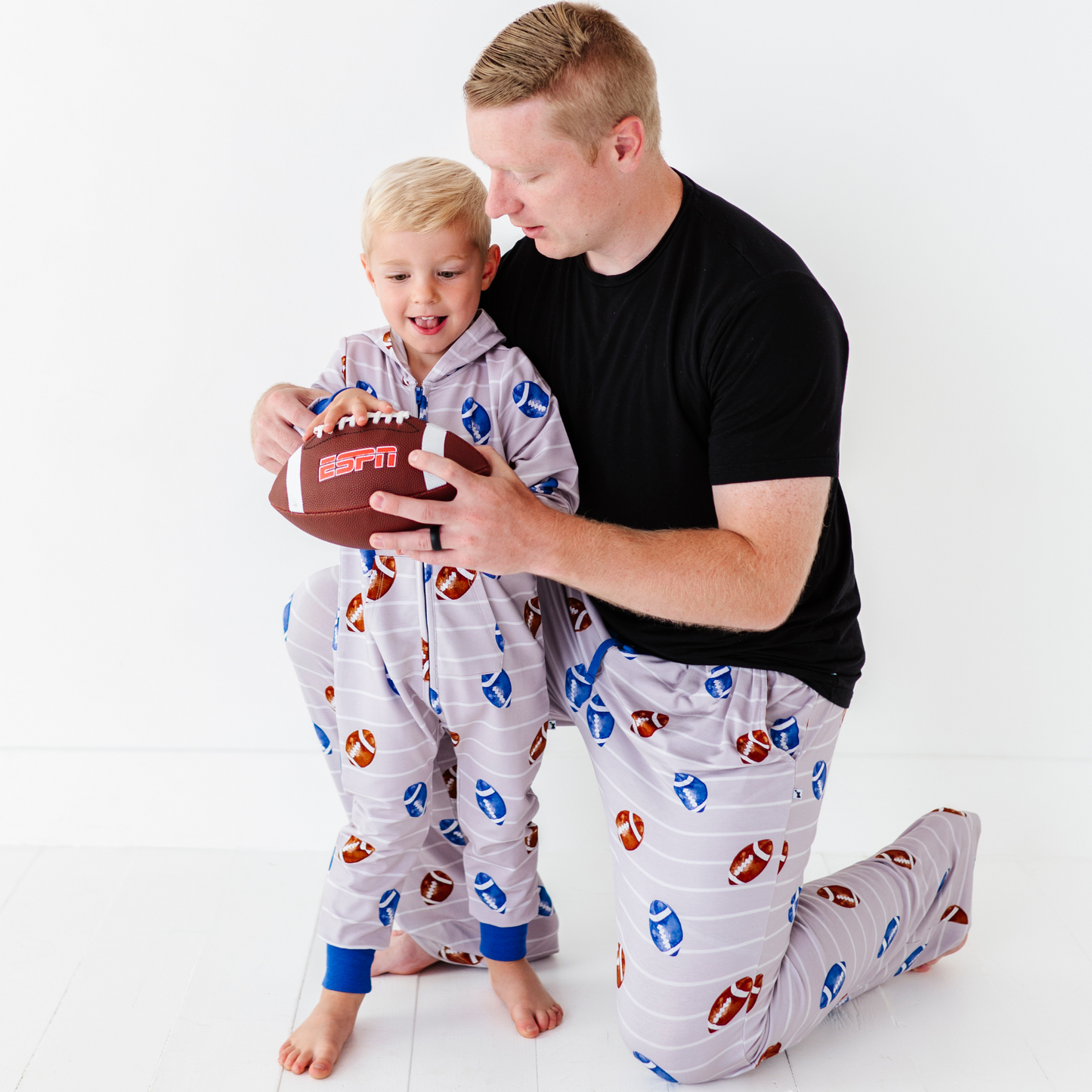 Father and son matching football pajamas