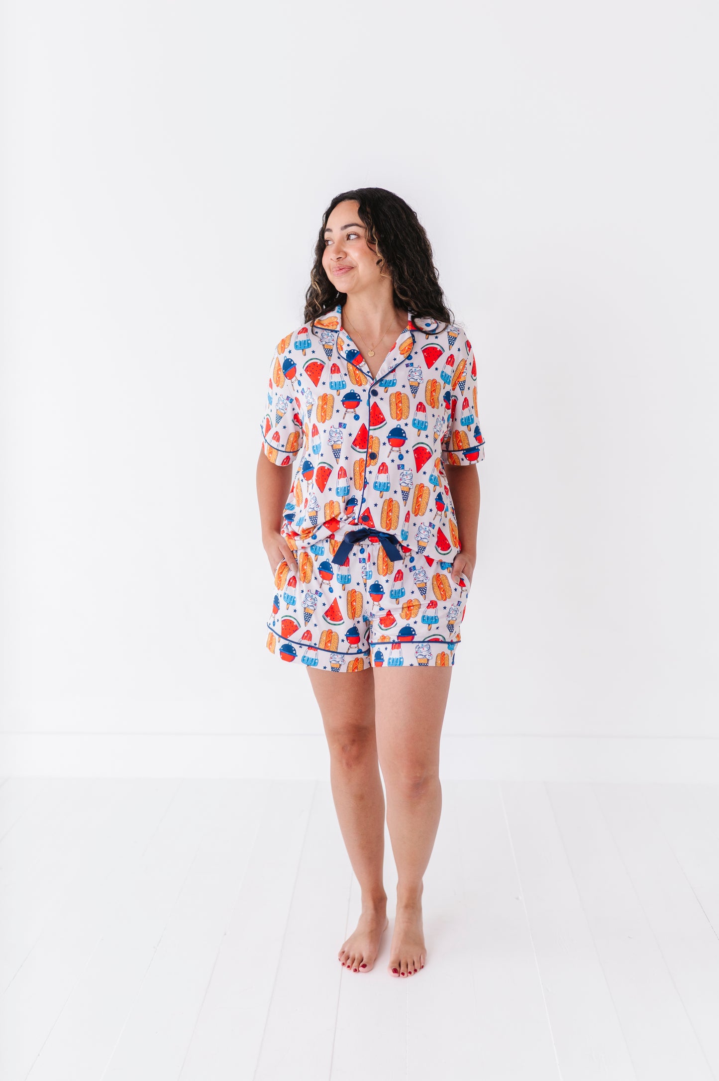 Mom wearing 4th of July hot dog pajamas made from soft bamboo fabric, perfect for matching family sets