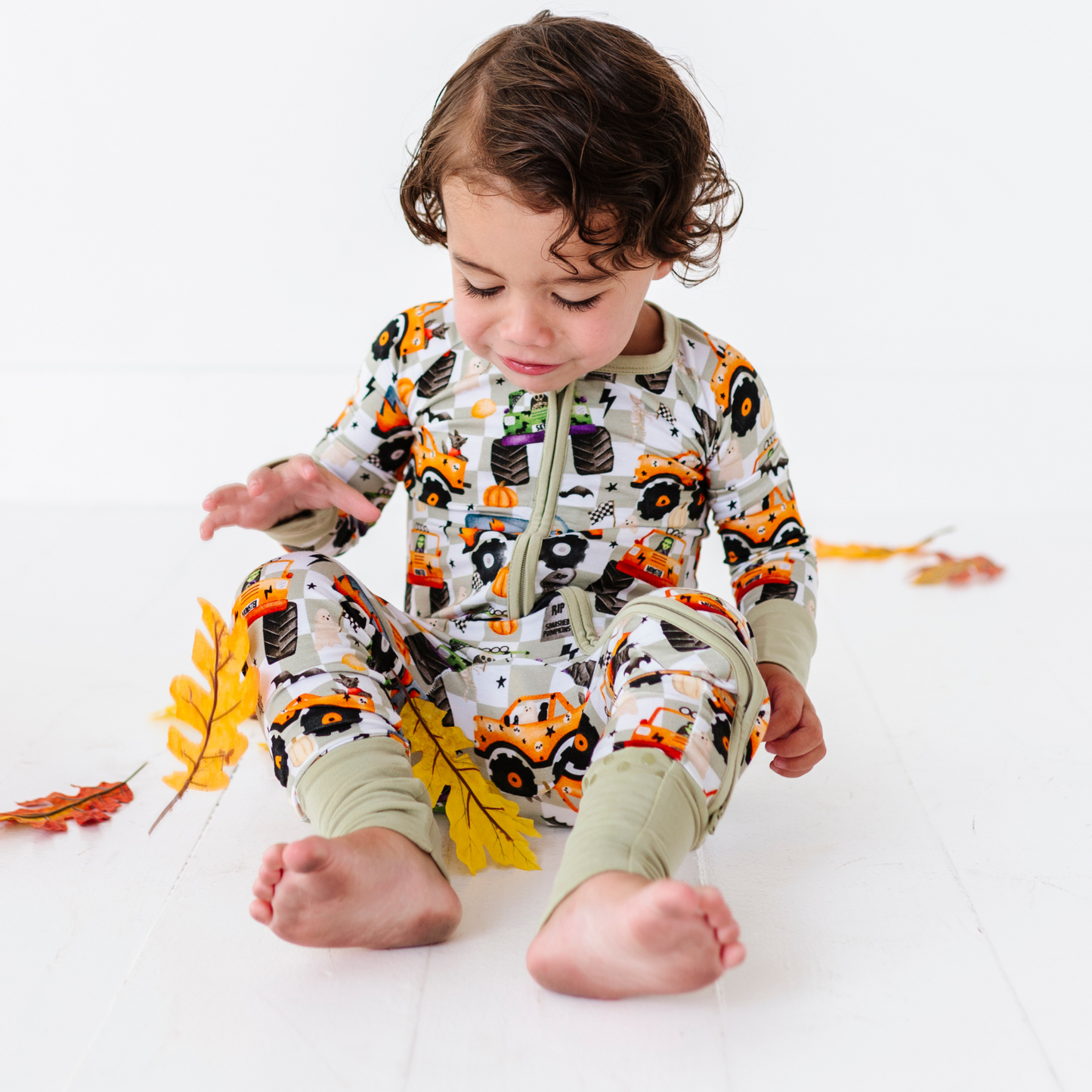 Boy in Halloween Monster Truck Pajamas by Kiki and Lulu