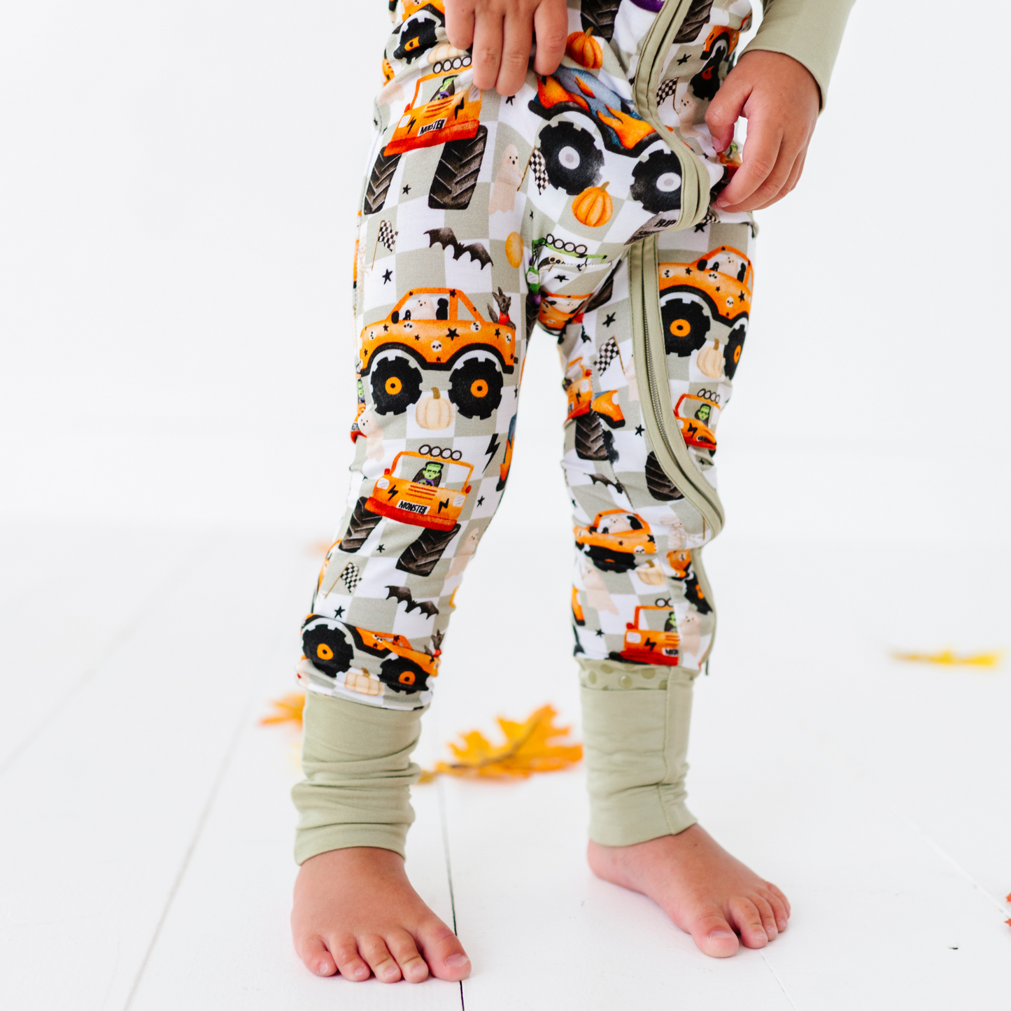 Boy in Halloween Monster Truck Pajamas by Kiki and Lulu