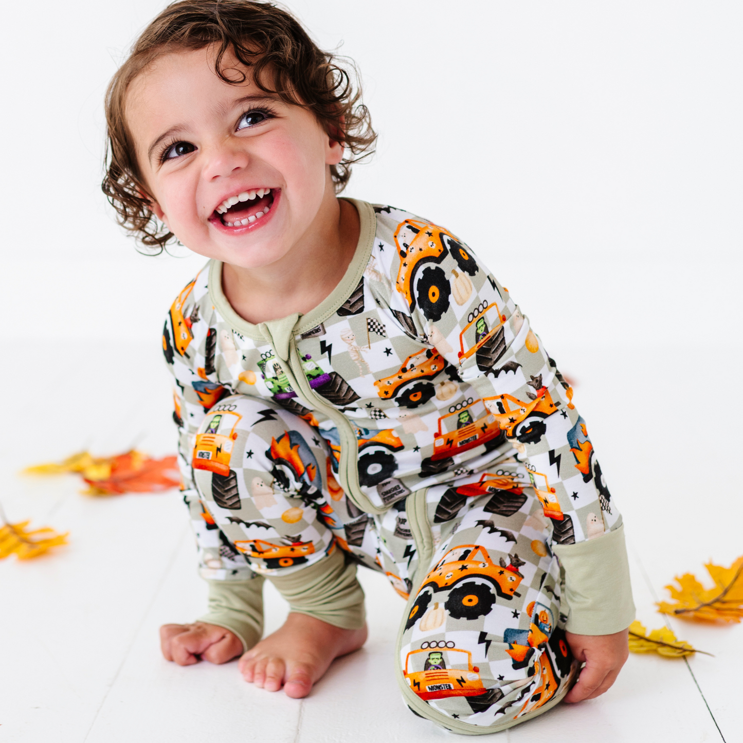 Boy in Halloween Monster Truck Pajamas by Kiki and Lulu