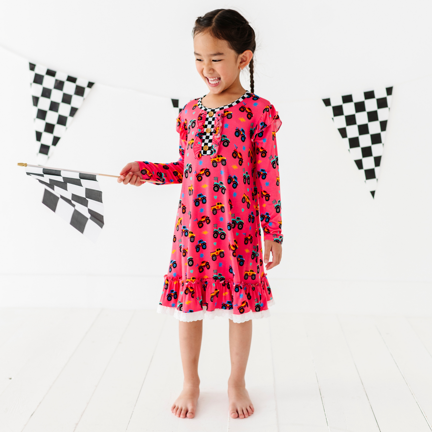 Girl in Monster Truck nightgown by Kiki and Lulu