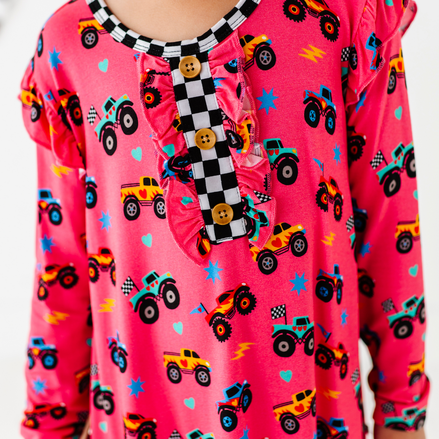 Girl in Monster Truck nightgown by Kiki and Lulu