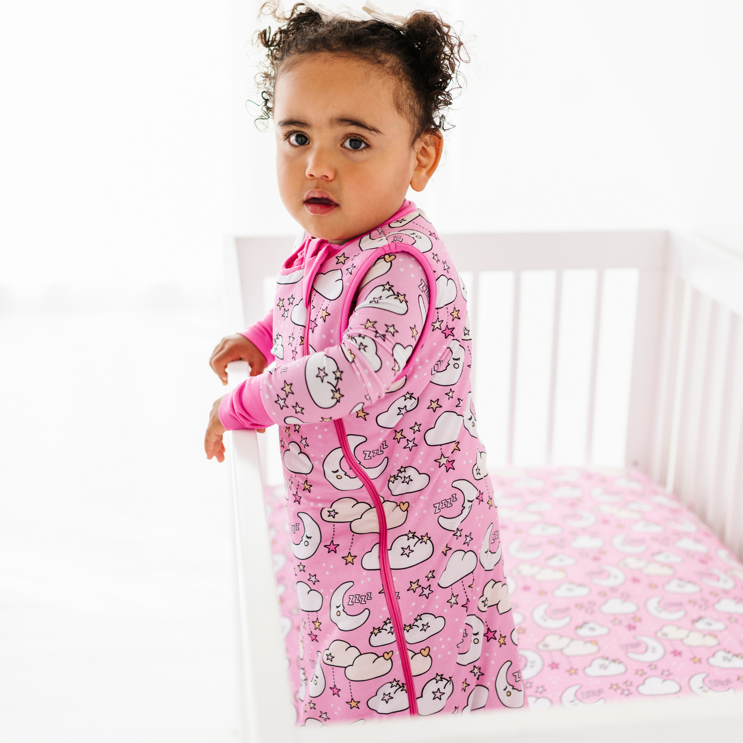 Baby in pink sleep bag by Kiki and Lulu