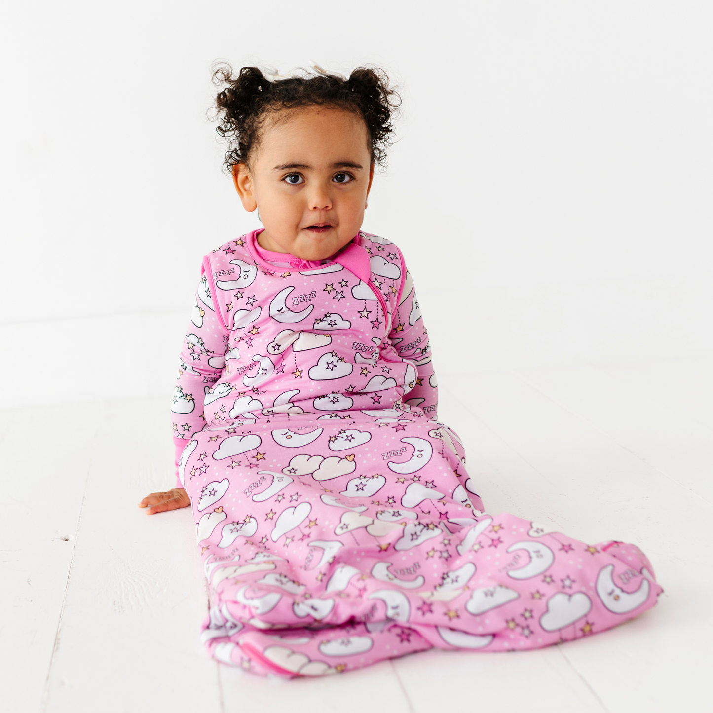 Baby in pink sleep bag by Kiki and Lulu