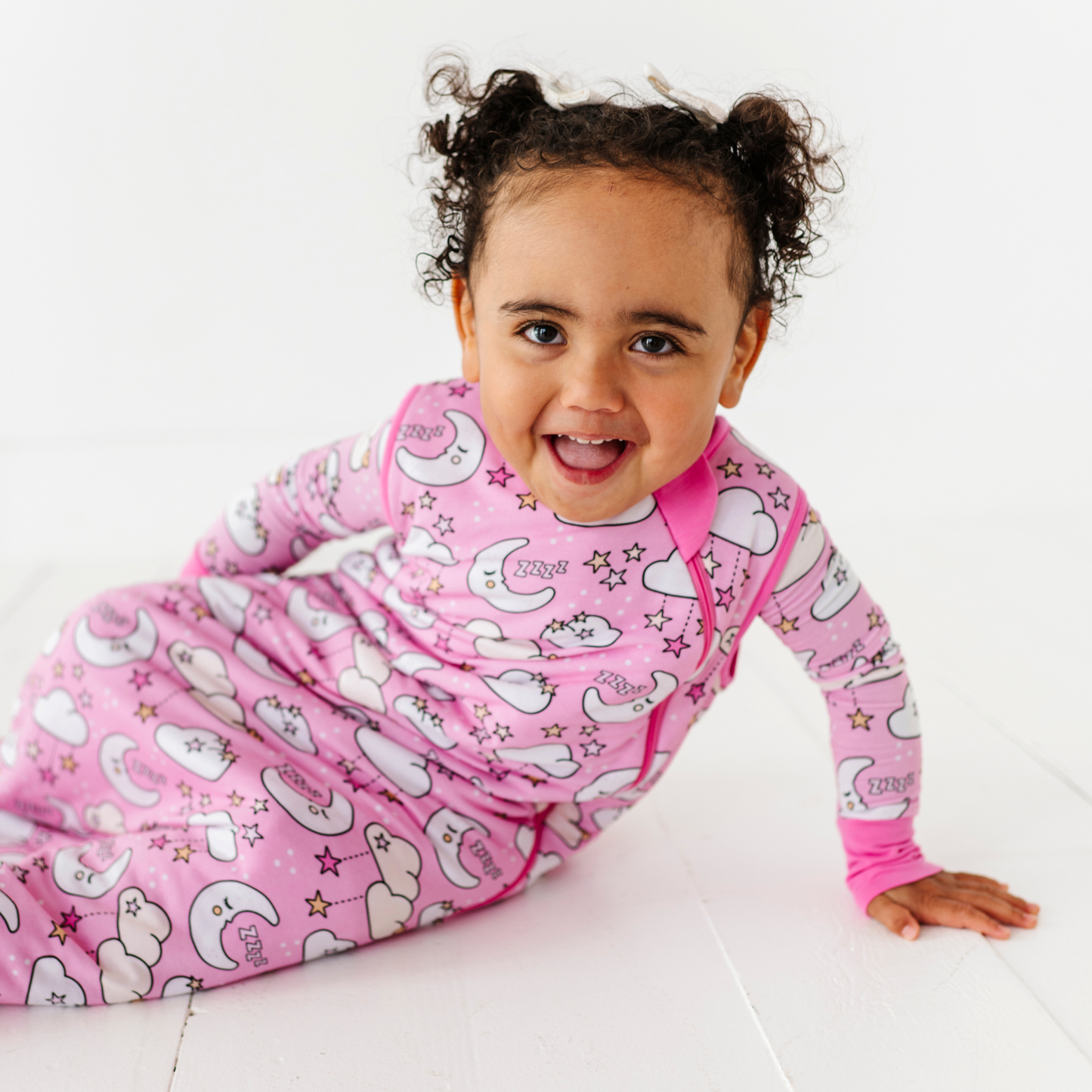 Baby in pink sleep bag by Kiki and Lulu