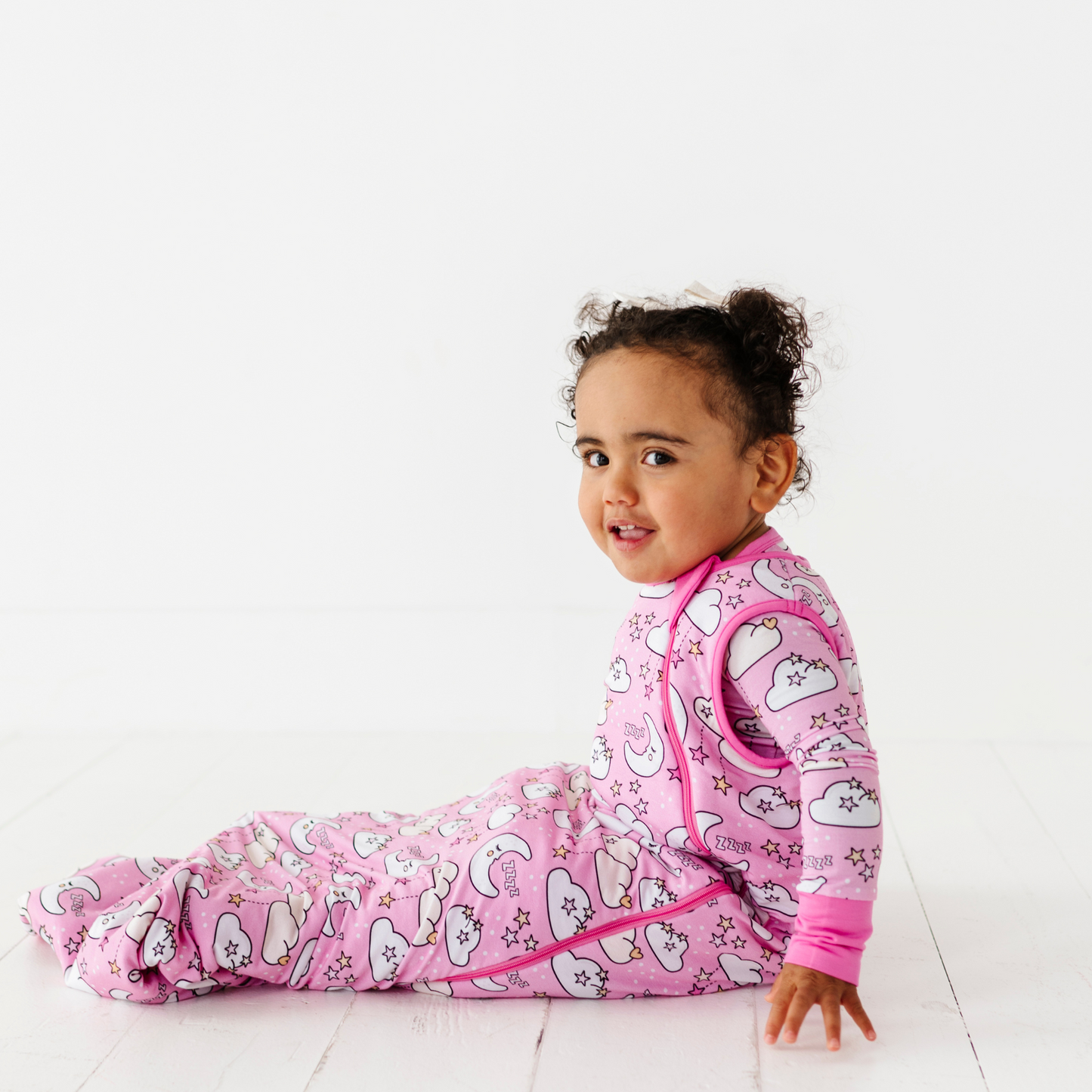 Baby in pink sleep bag by Kiki and Lulu