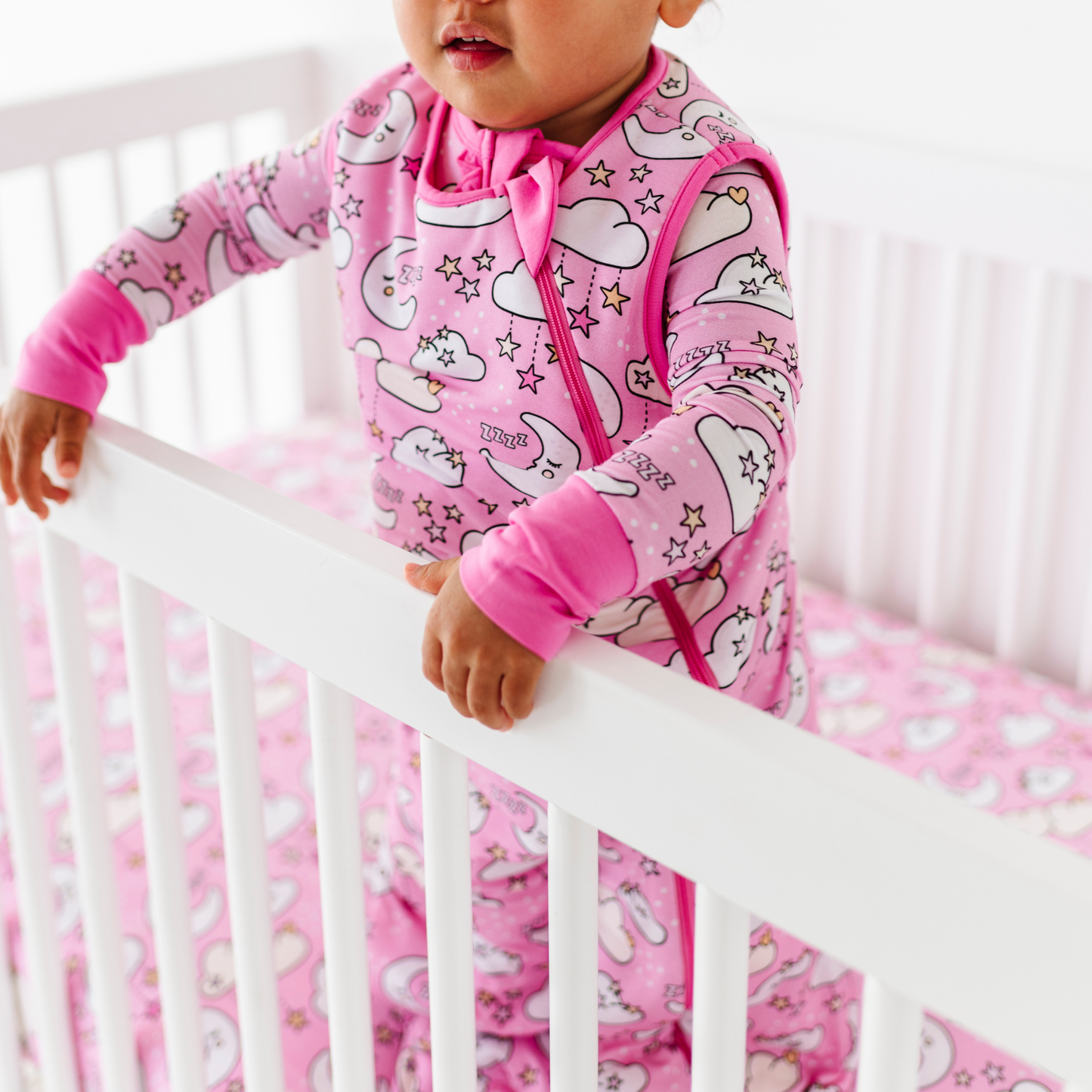 Baby in pink sleep bag by Kiki and Lulu