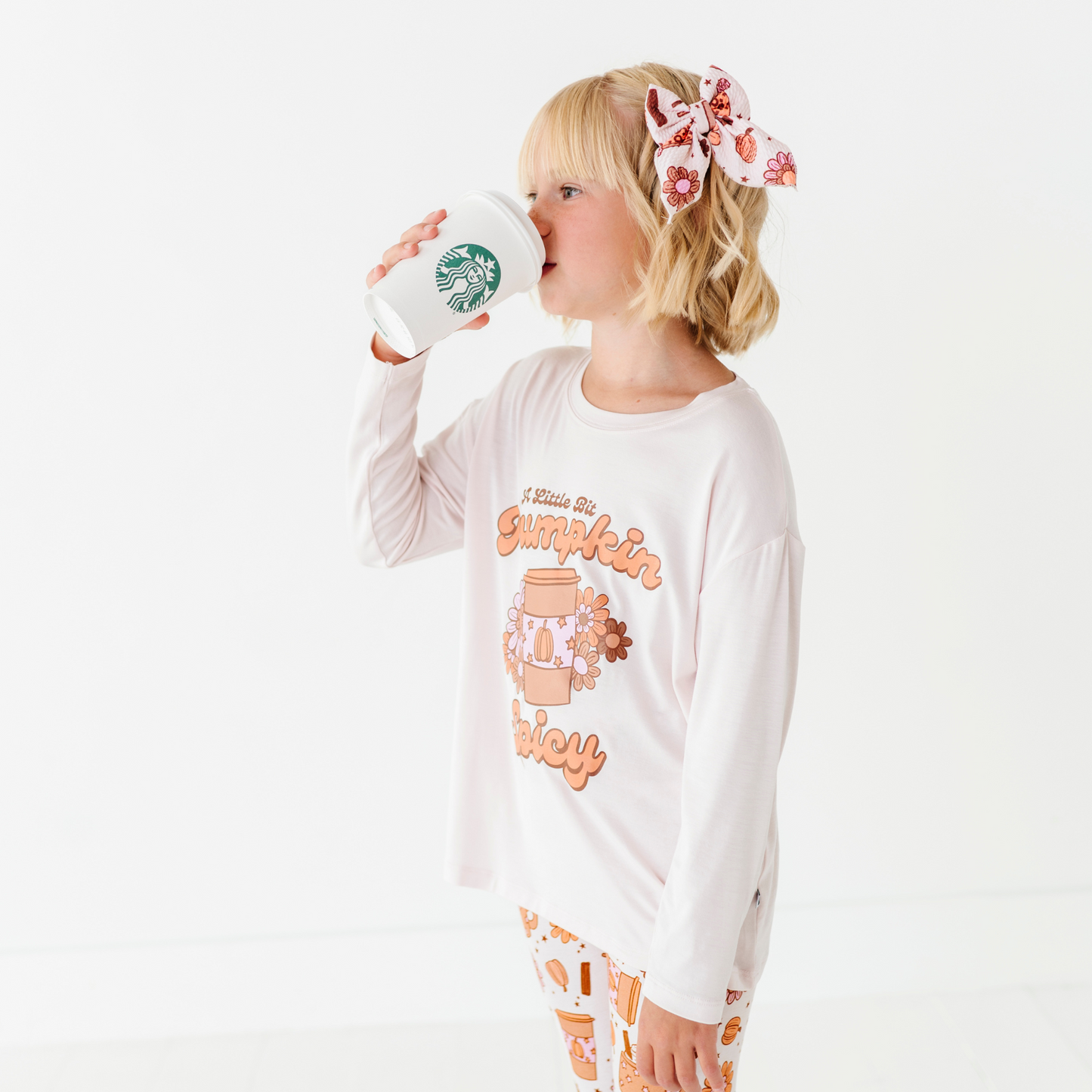 Girl in pumpkin spice latte set