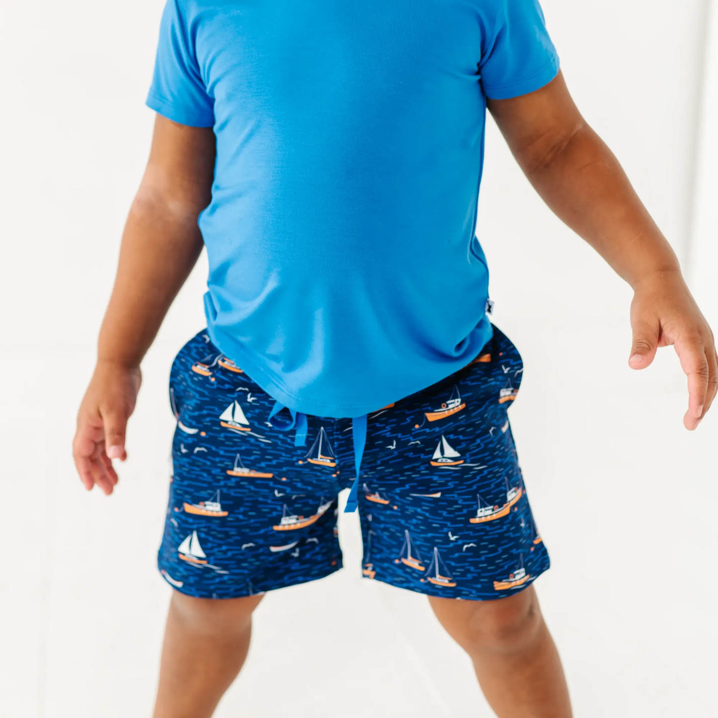 Boy in Sailboat shorts by Kiki and Lulu