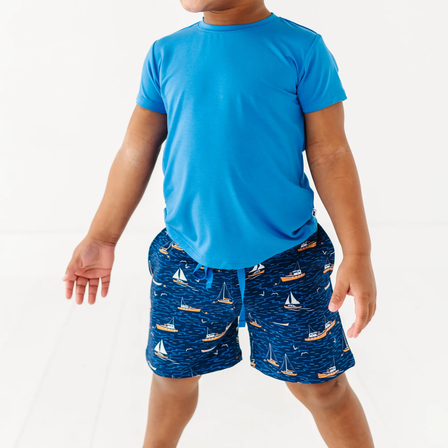 Boy in Sailboat shorts by Kiki and Lulu