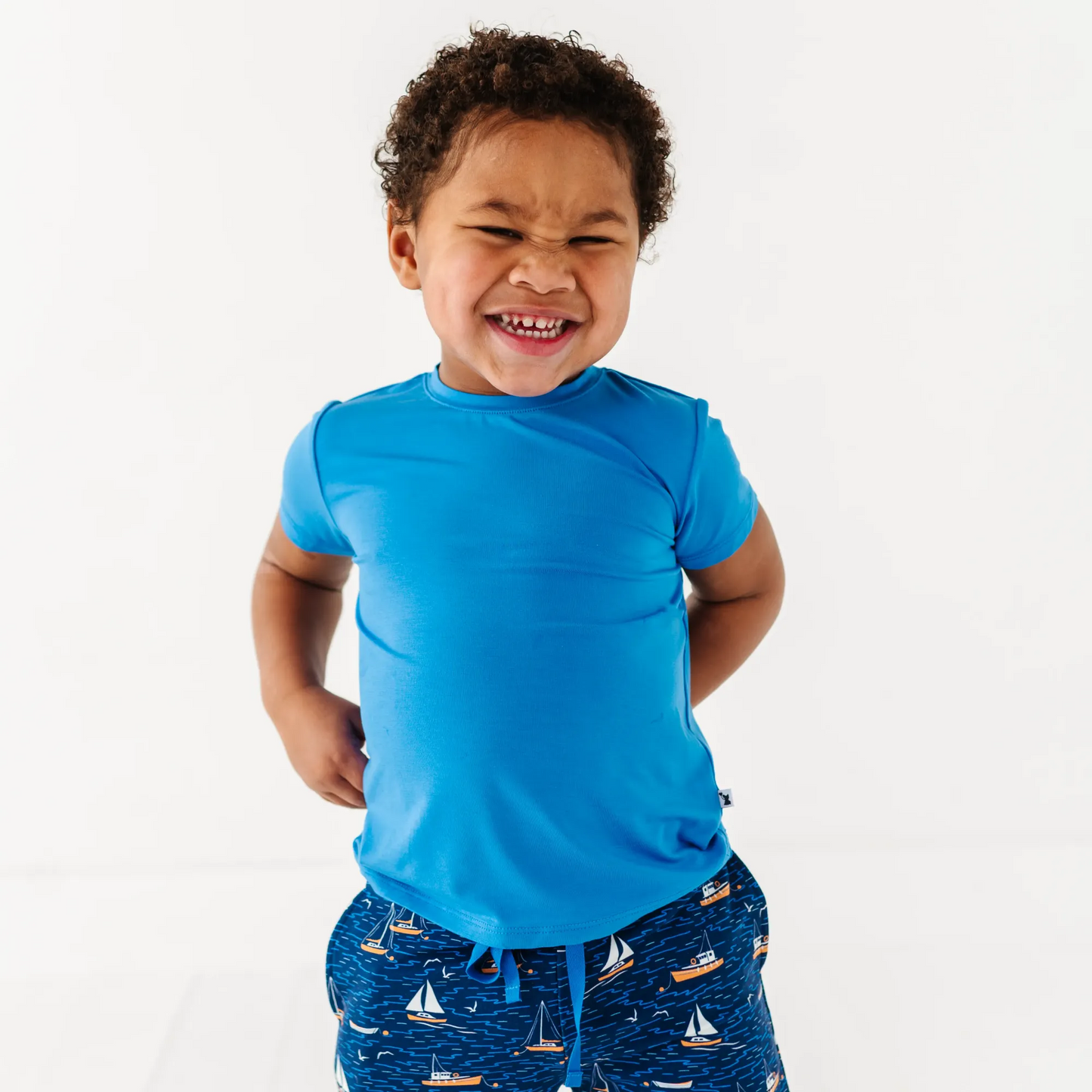 Boy in Sailboat shorts by Kiki and Lulu