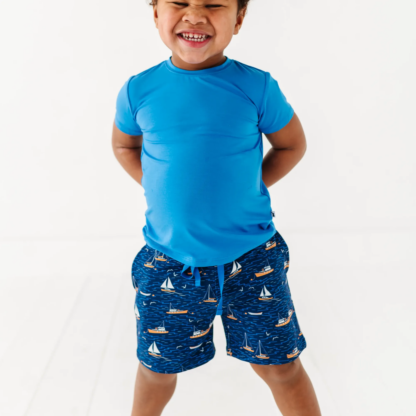 Boy in Sailboat shorts by Kiki and Lulu