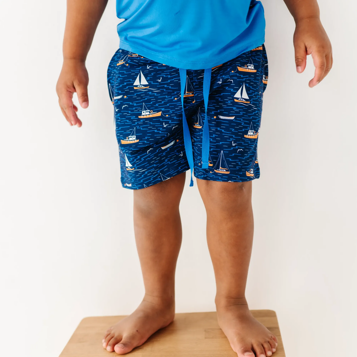Boy in Sailboat shorts by Kiki and Lulu