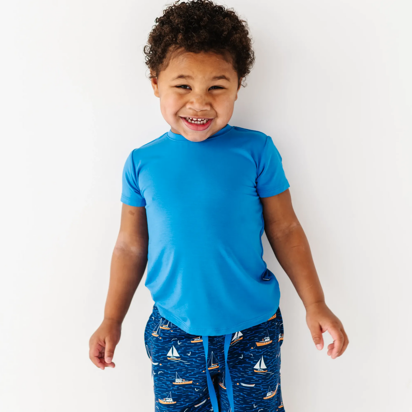 Boy in Sailboat shorts by Kiki and Lulu
