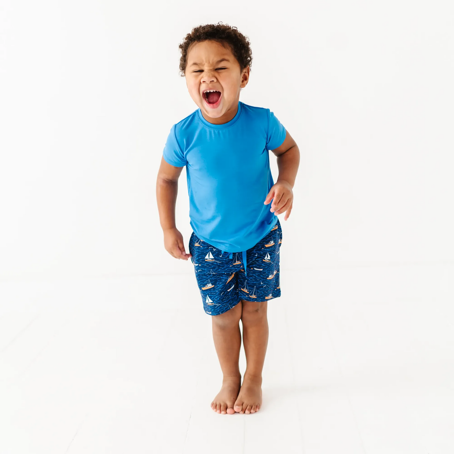 Boy in Sailboat shorts by Kiki and Lulu