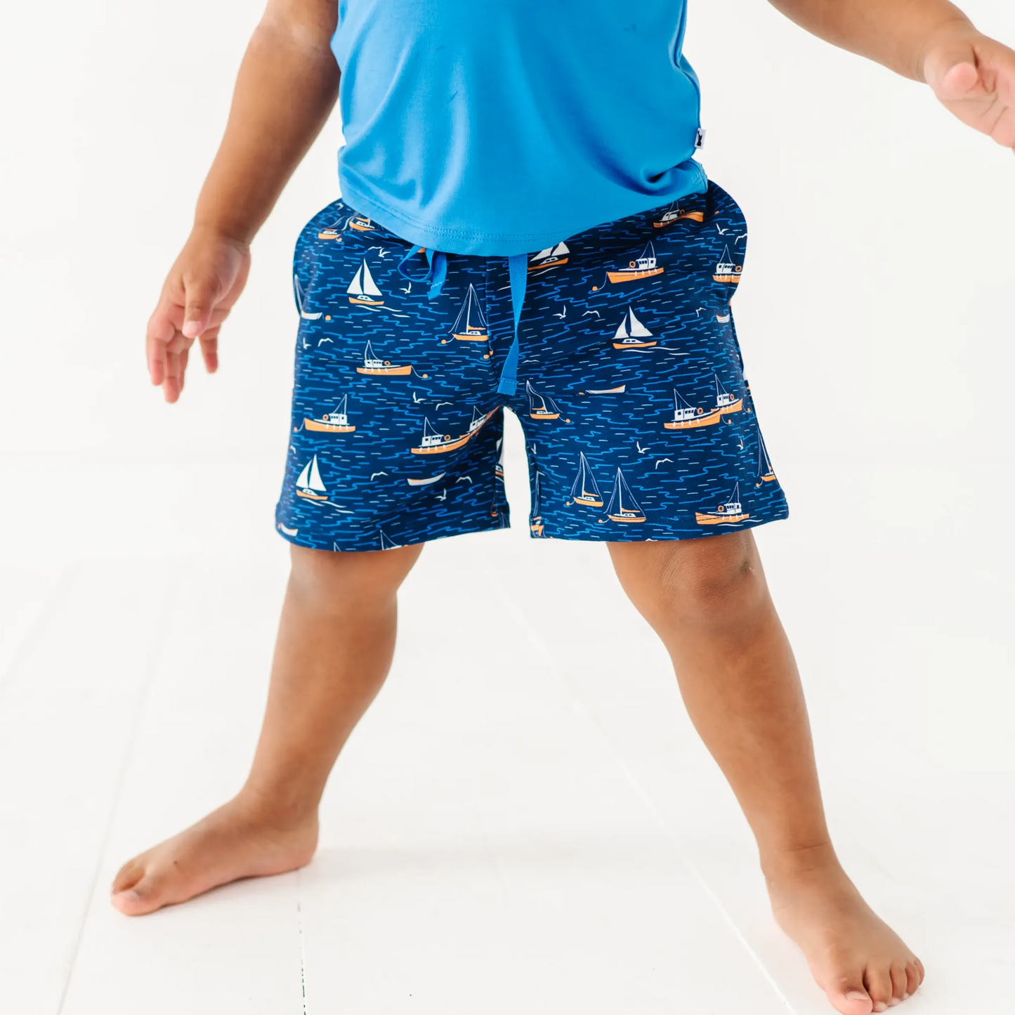Boy in Sailboat shorts by Kiki and Lulu