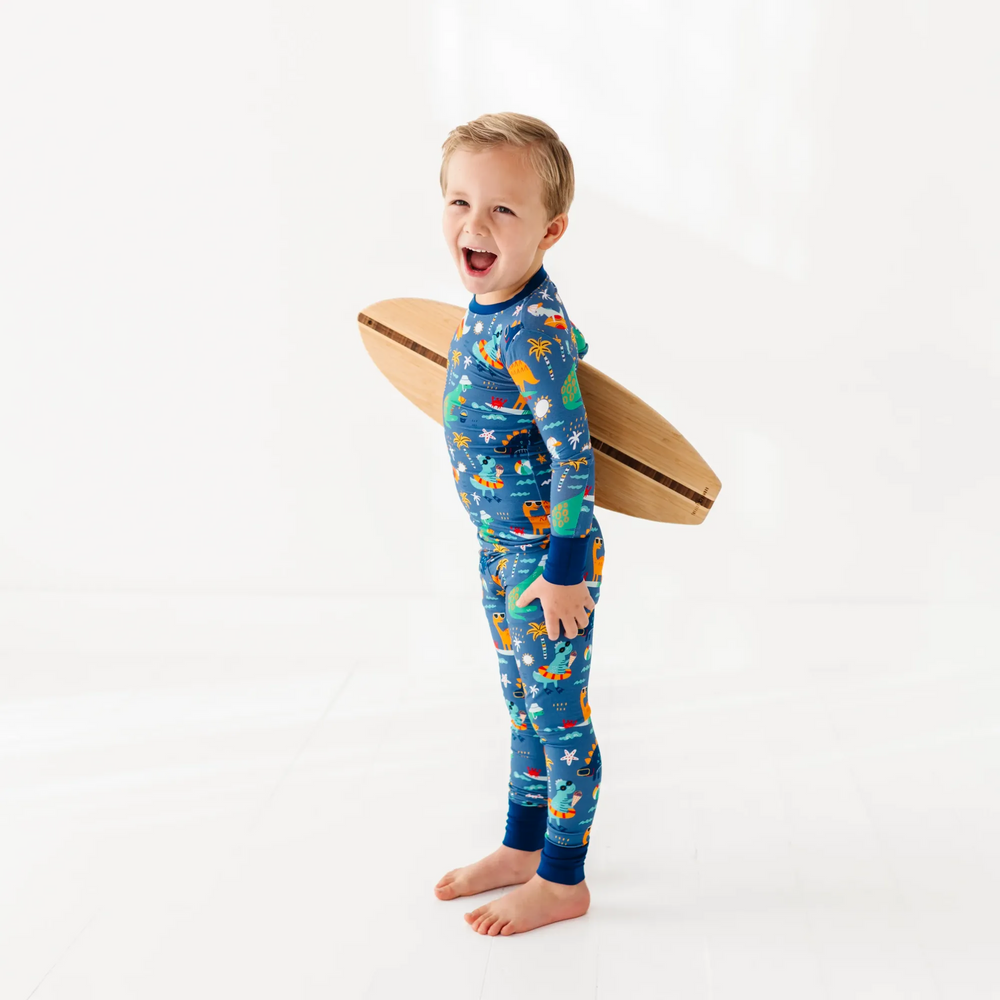 
                      
                        Blue dinosaur bamboo pajamas by Kiki and Lulu
                      
                    